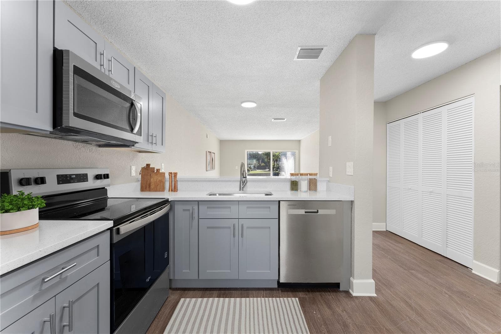 Kitchen (Virtually Staged) - 2508 WOODGATE BLVD #105, ORLANDO