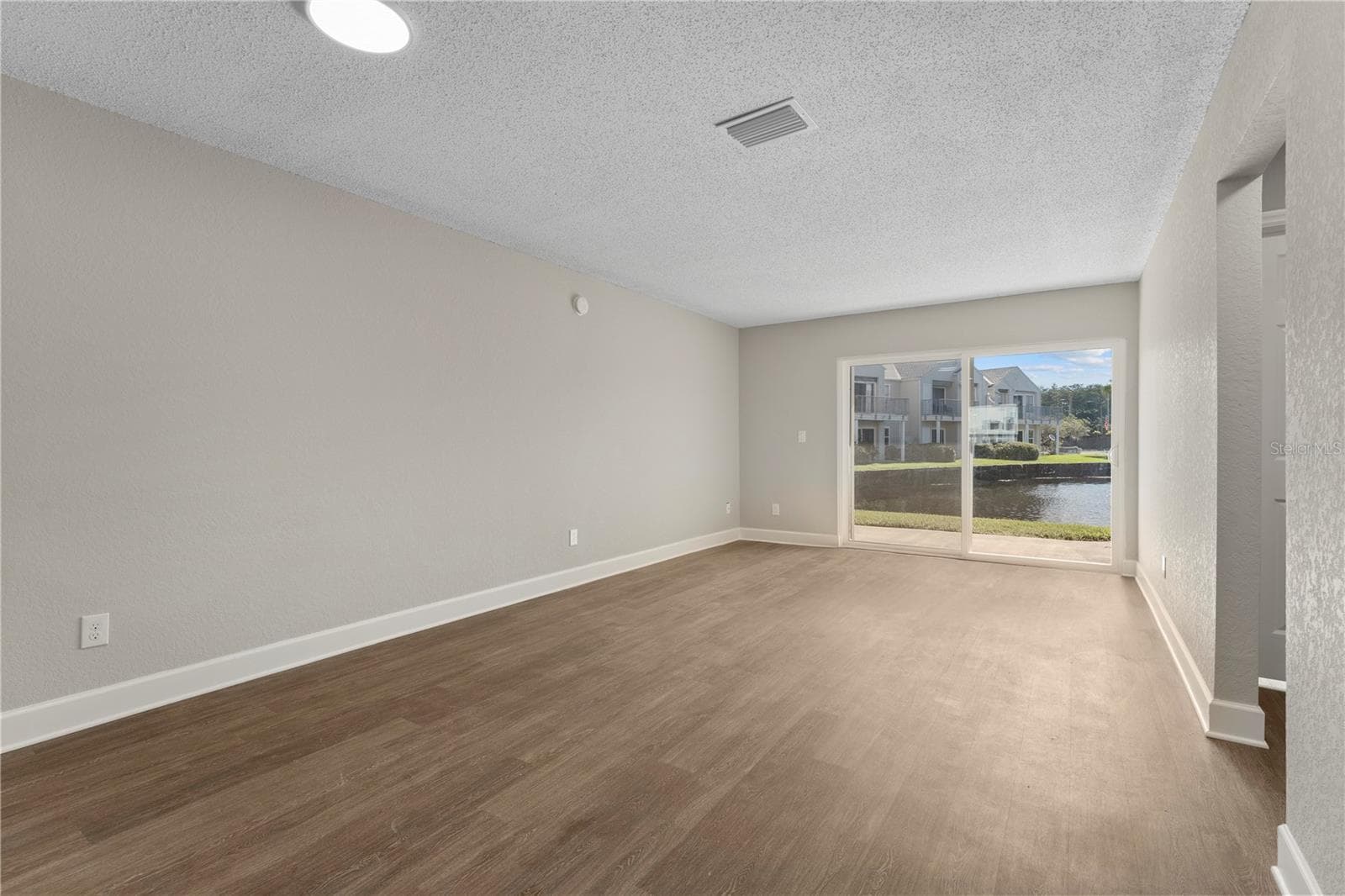 Great Room (Living + Dining) - 2508 WOODGATE BLVD #105, ORLANDO