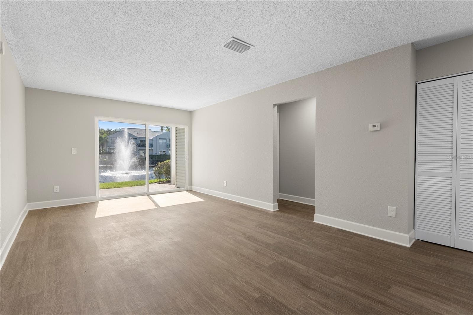 Great Room (Living + Dining) - 2508 WOODGATE BLVD #105, ORLANDO