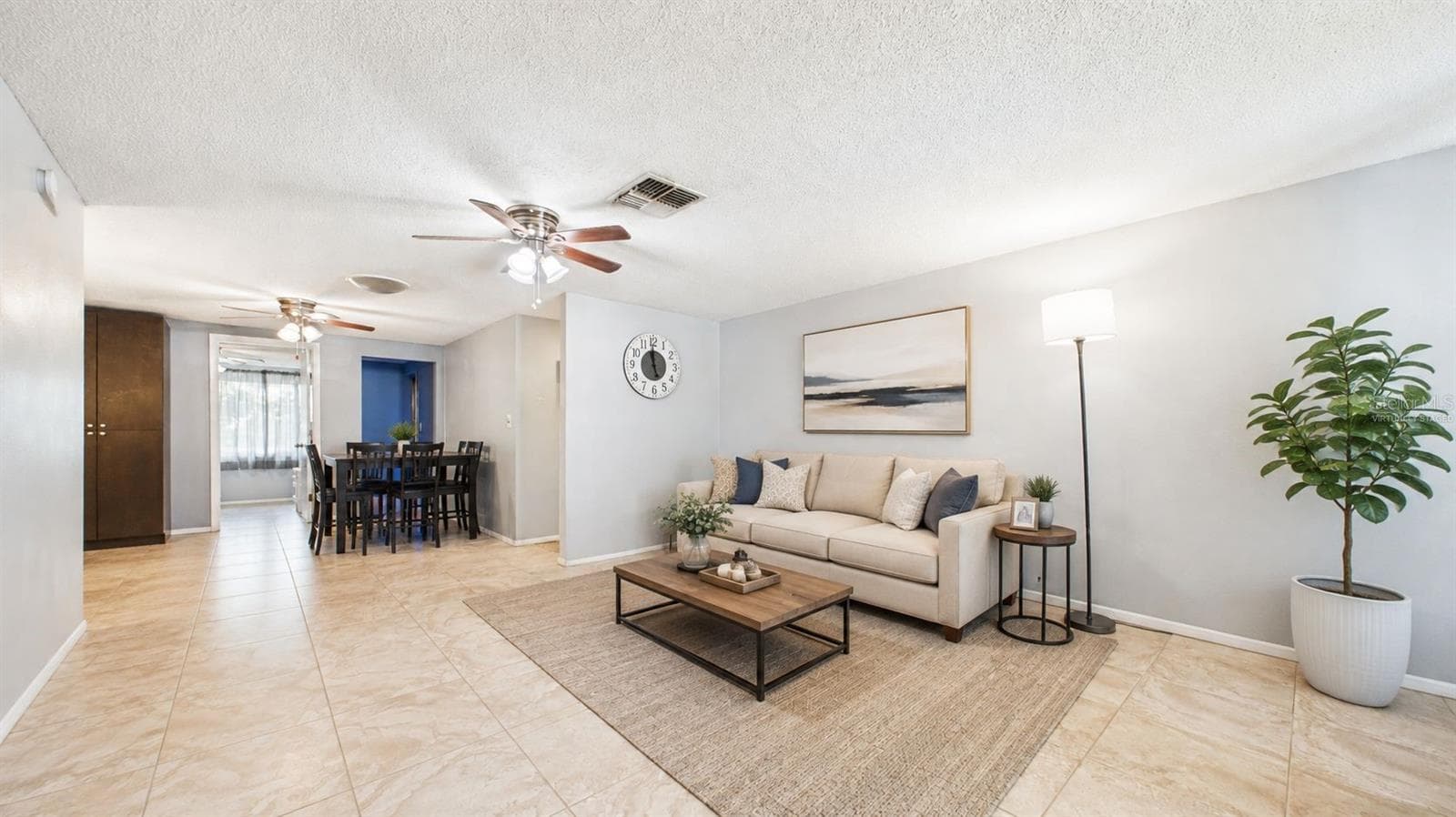 Virtually staged, Living room upon entrance - 8840 CARMEN LN, PORT RICHEY