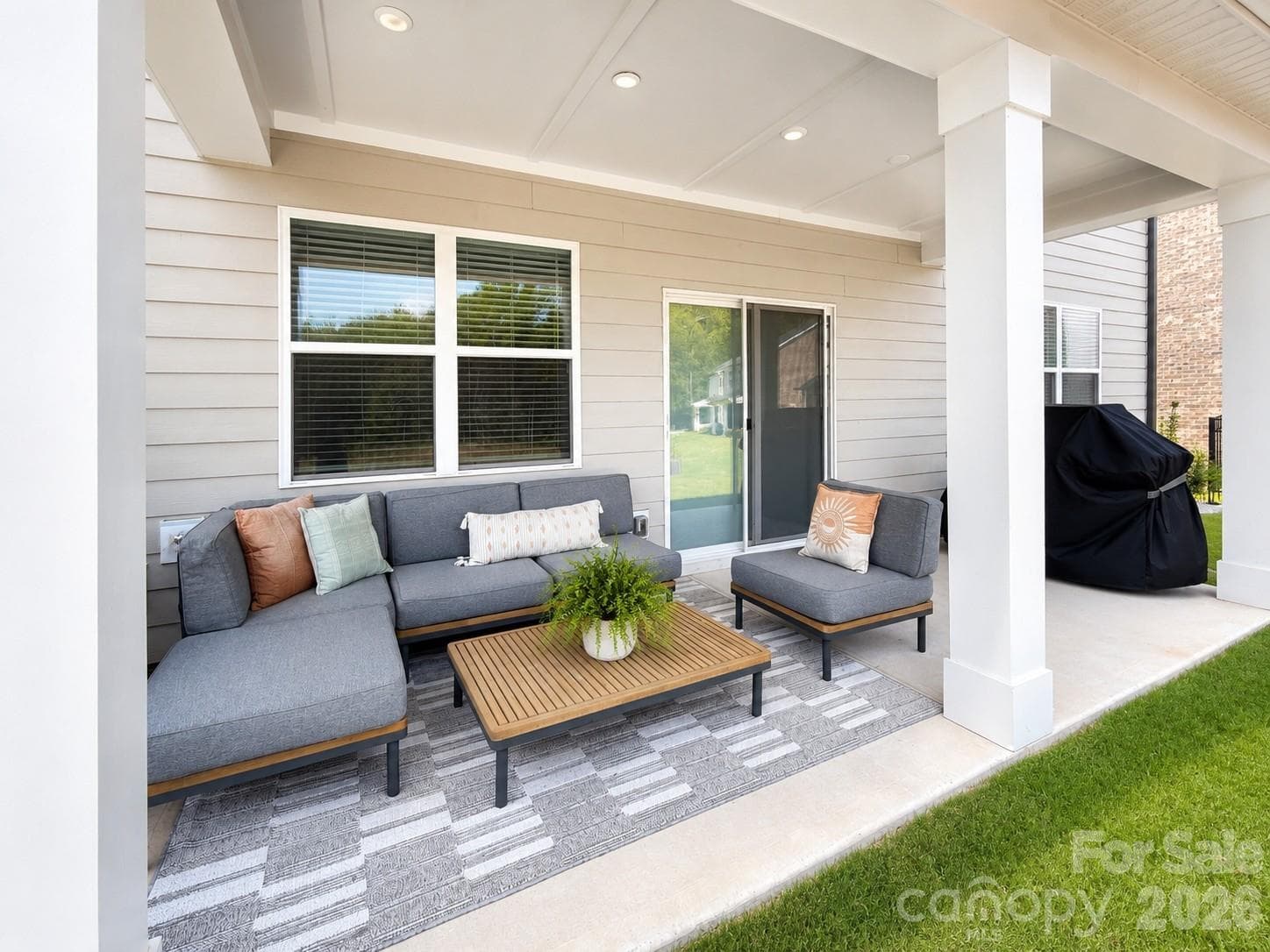 Covered back porch has a very peaceful setting - 8226 Franklin Trail Street, Mint Hill