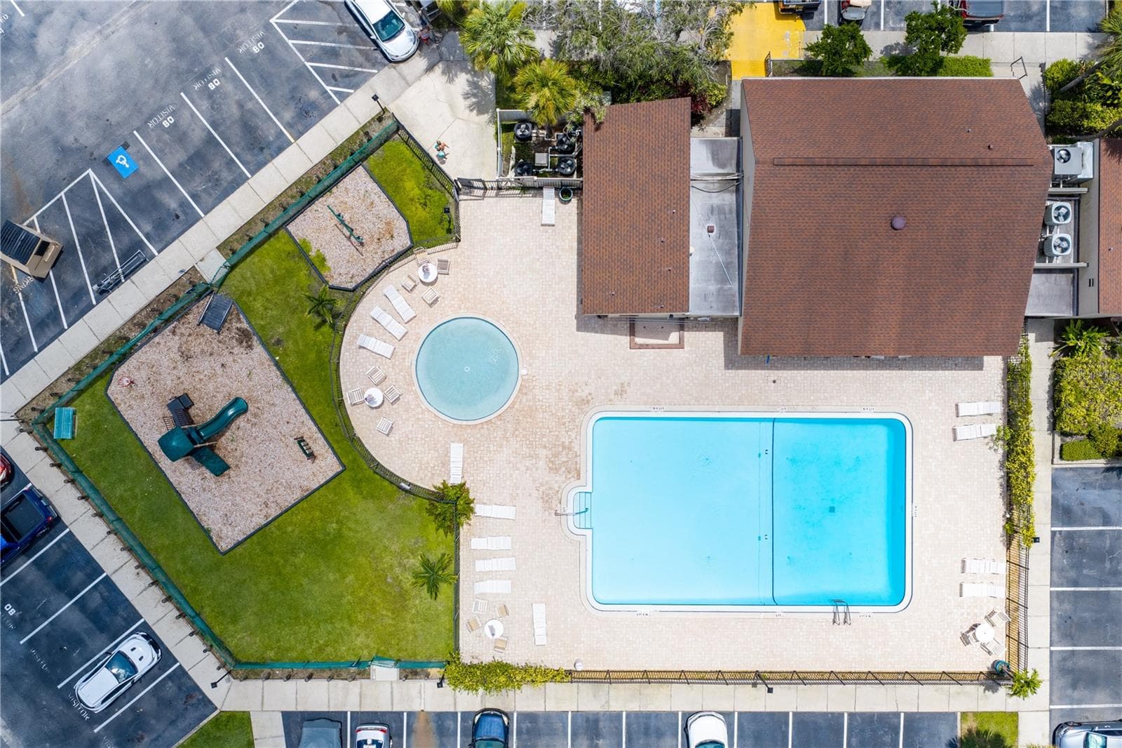 Enjoy two pools, tennis and pickleball courts, playground, quiet settings, carwash stations, clubhouse and more. - 782 VILLAGE LAKE TER N #103, ST PETERSBURG