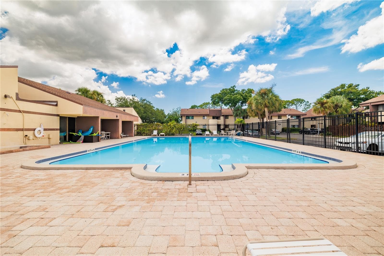The large main pool, is perfect for your daily laps and exercise - 782 VILLAGE LAKE TER N #103, ST PETERSBURG