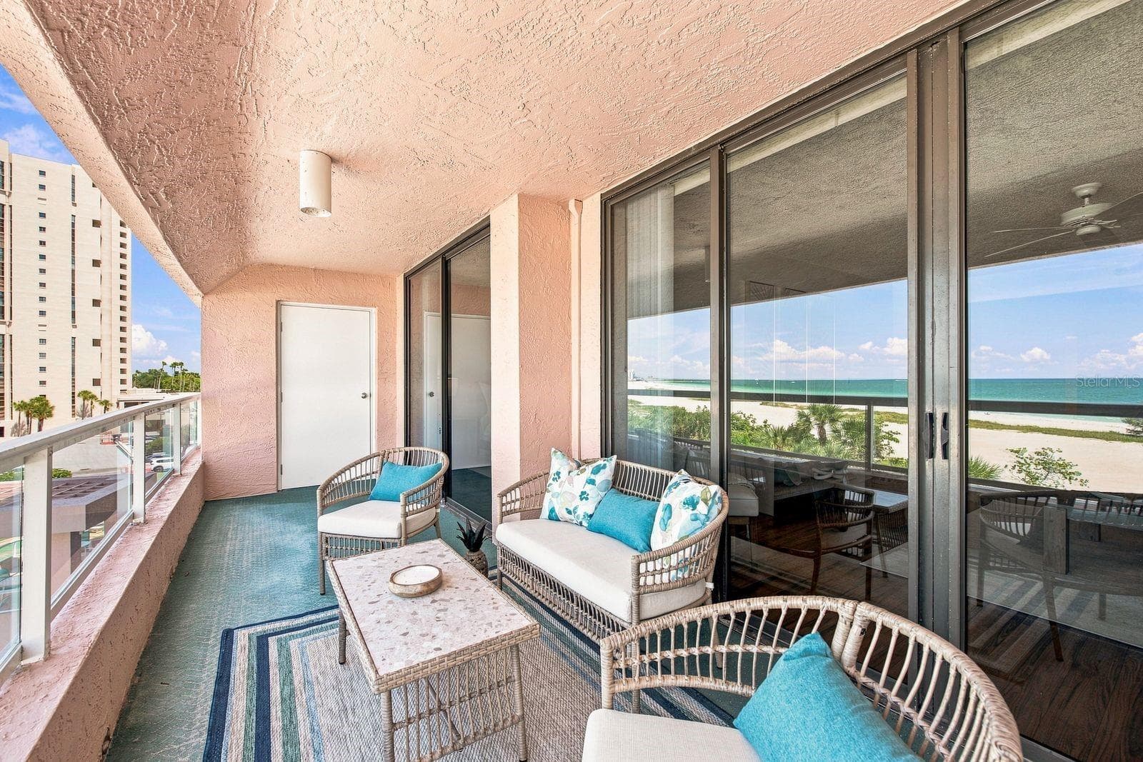 Large Balcony extends from living room to primary bedroom - 1310 GULF BLVD #4D, CLEARWATER BEACH