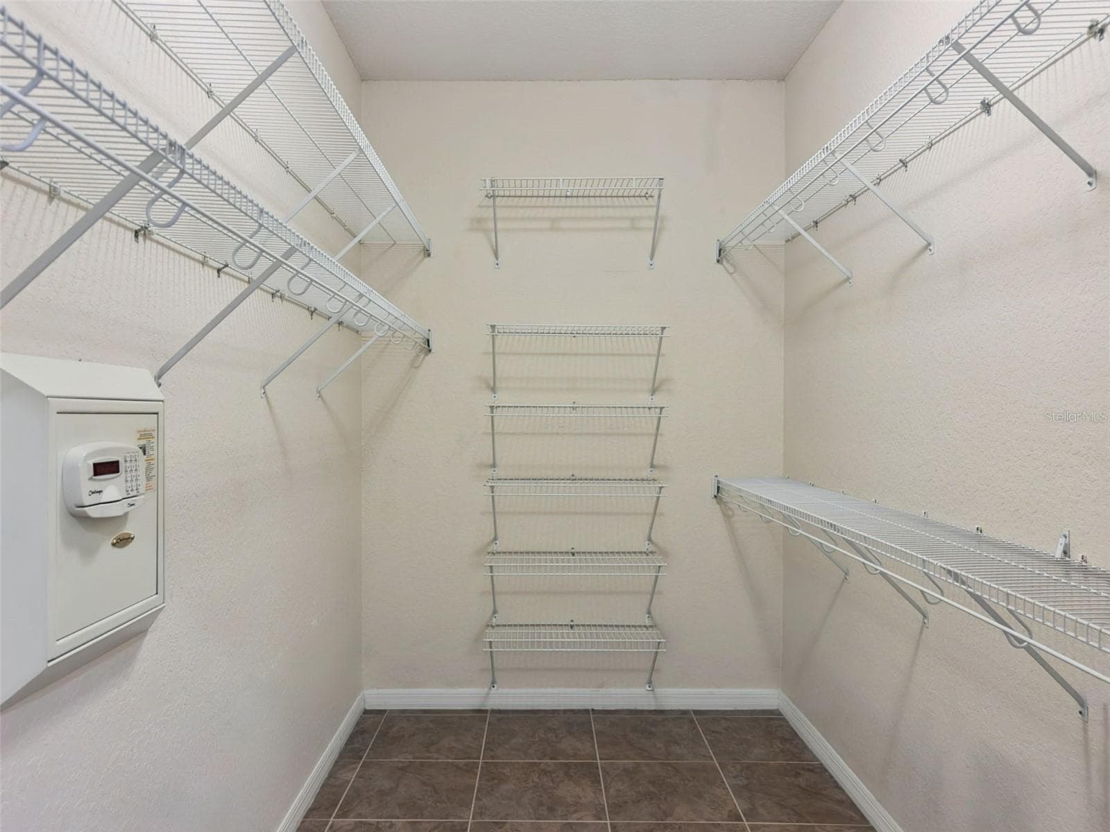 Primary Bedroom Walk-In Closet - 5937 TROPHY LOOP, LAKELAND