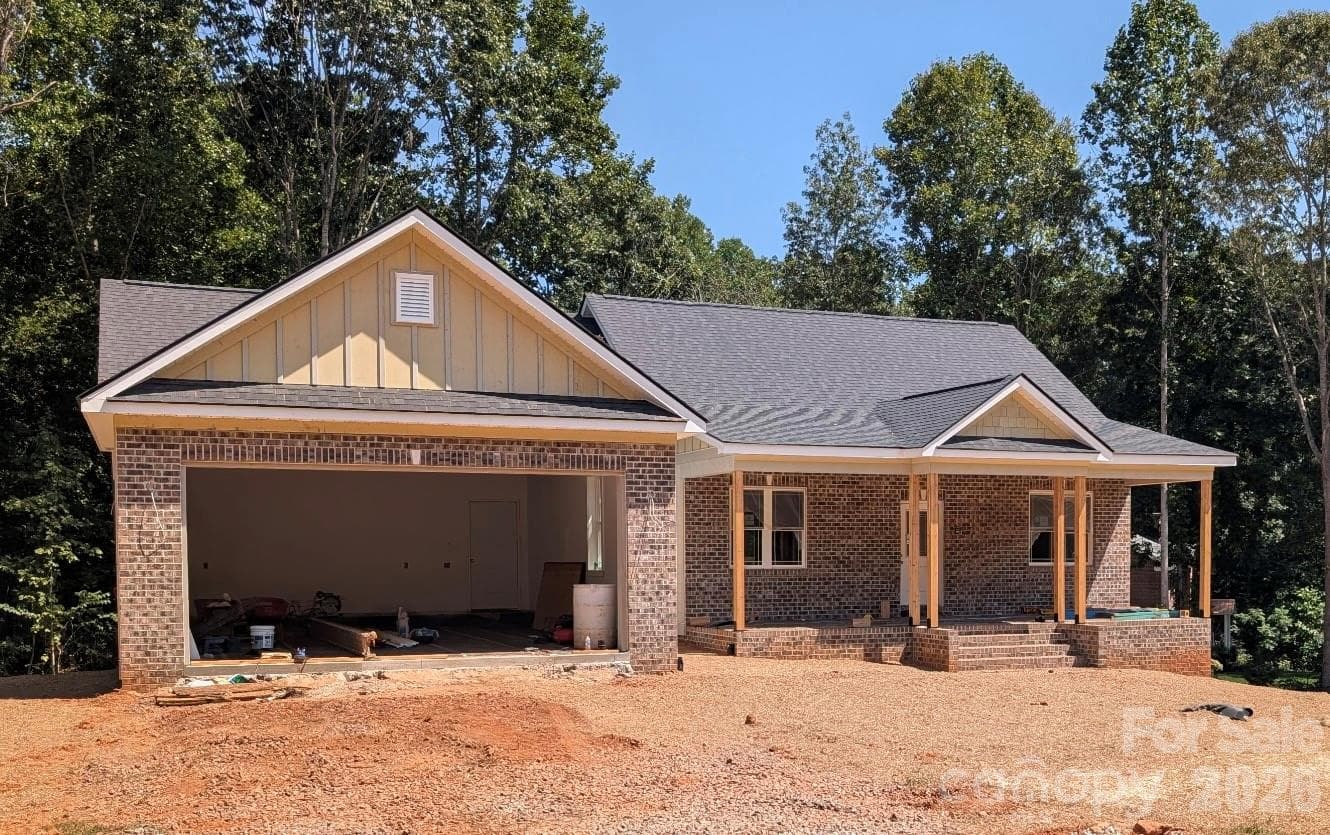 Front view focusing on the over size two car garage - Newton