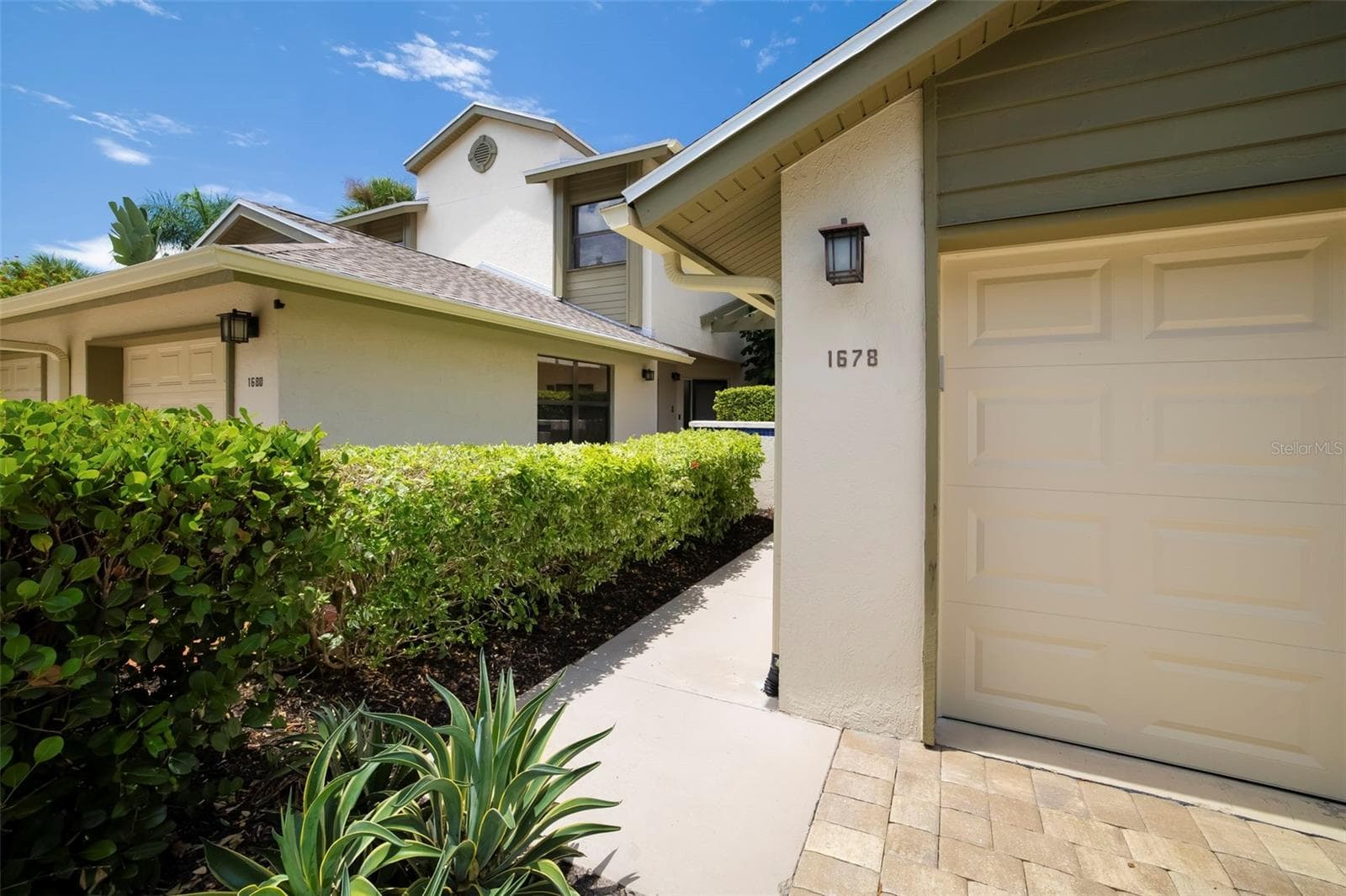 Front Entry & Garage - 1678 STARLING DR #102, SARASOTA