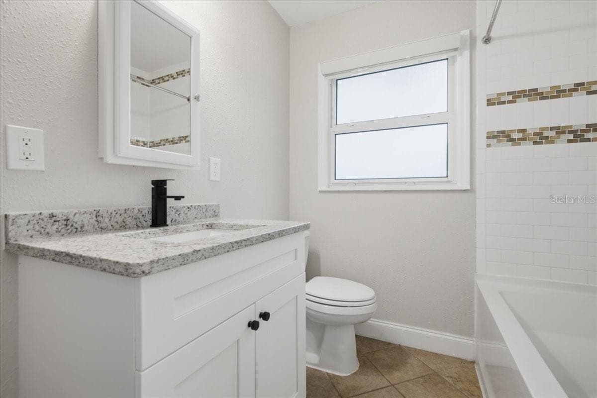 Updated Bathroom With Tub/Shower Combo - 1837 PASADENA DR, DUNEDIN