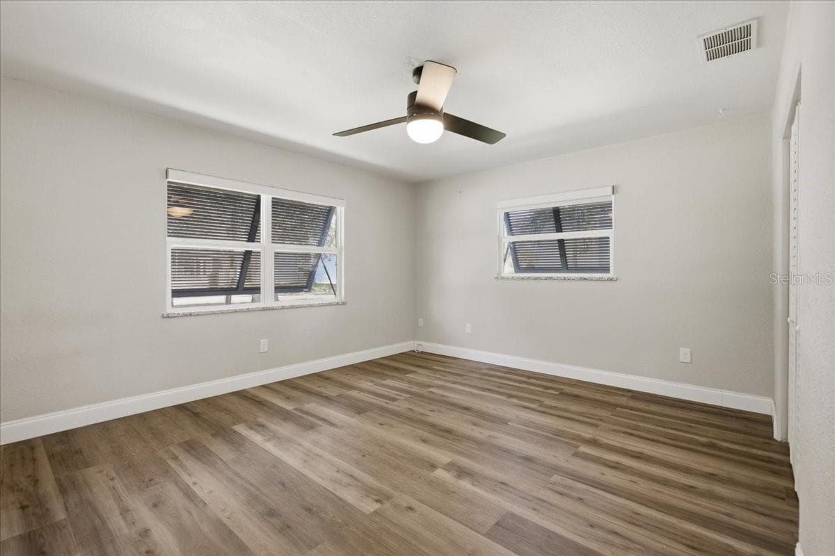 Primary Bedroom with Hurricane shutters - 1837 PASADENA DR, DUNEDIN