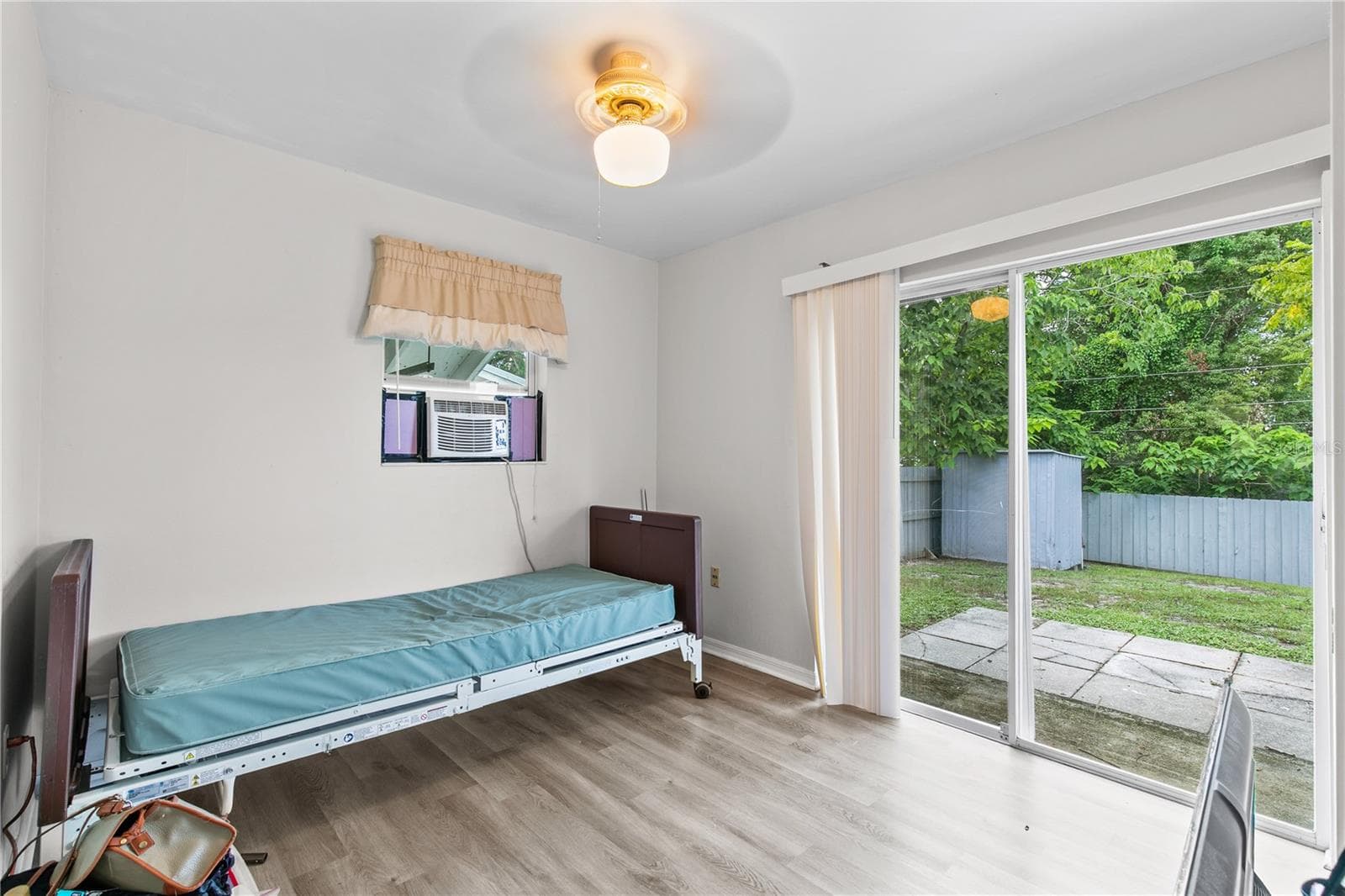 Bedroom with Sliding Door Access to Fenced Backyard - 930 ALFORD ST, TITUSVILLE