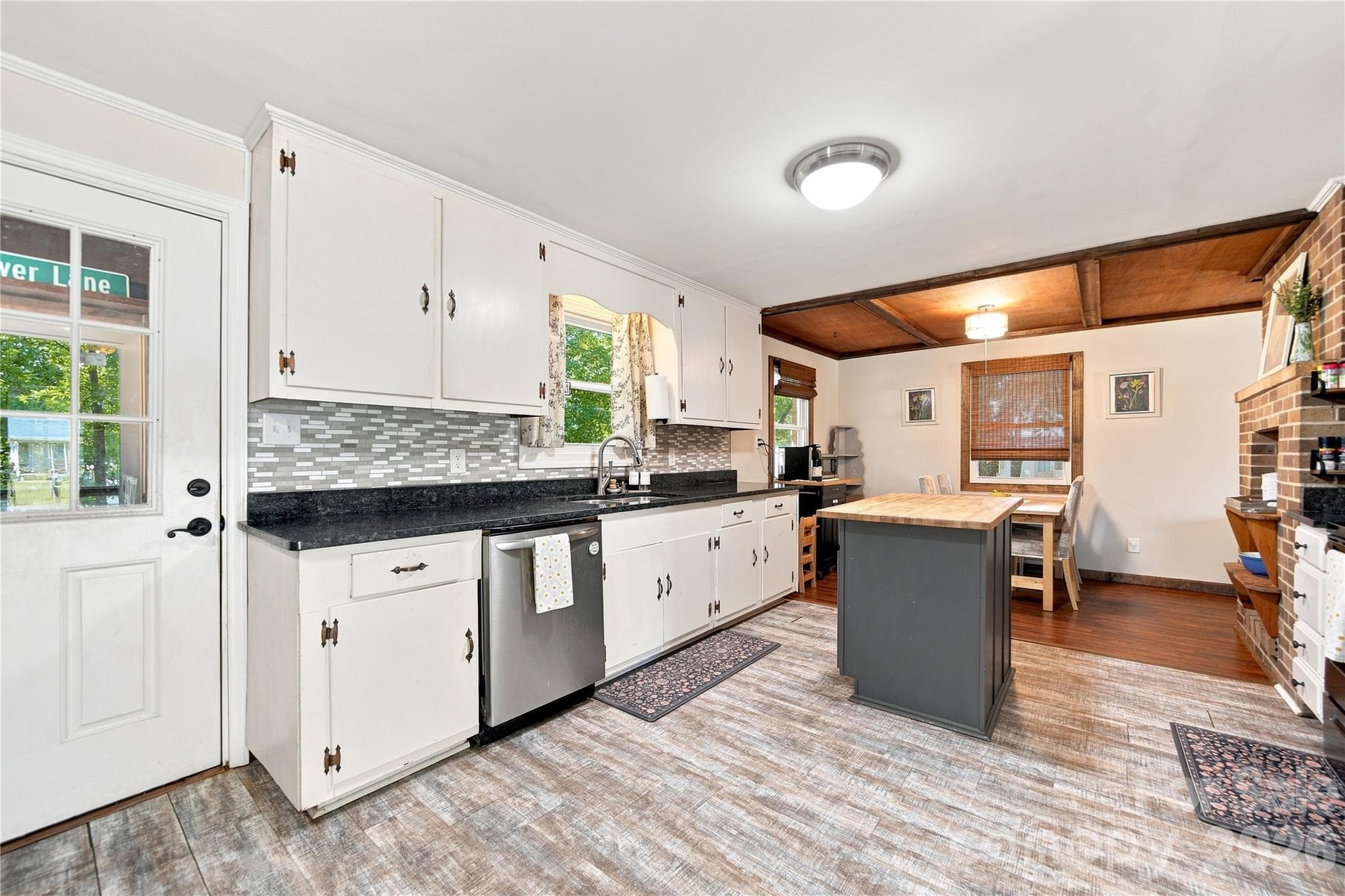 Kitchen w/access to back porch & yard - 7704 Otts Circle, Stanley