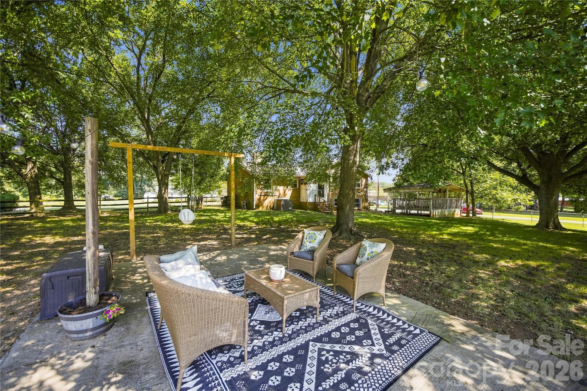 Patio in large yard - 7704 Otts Circle, Stanley