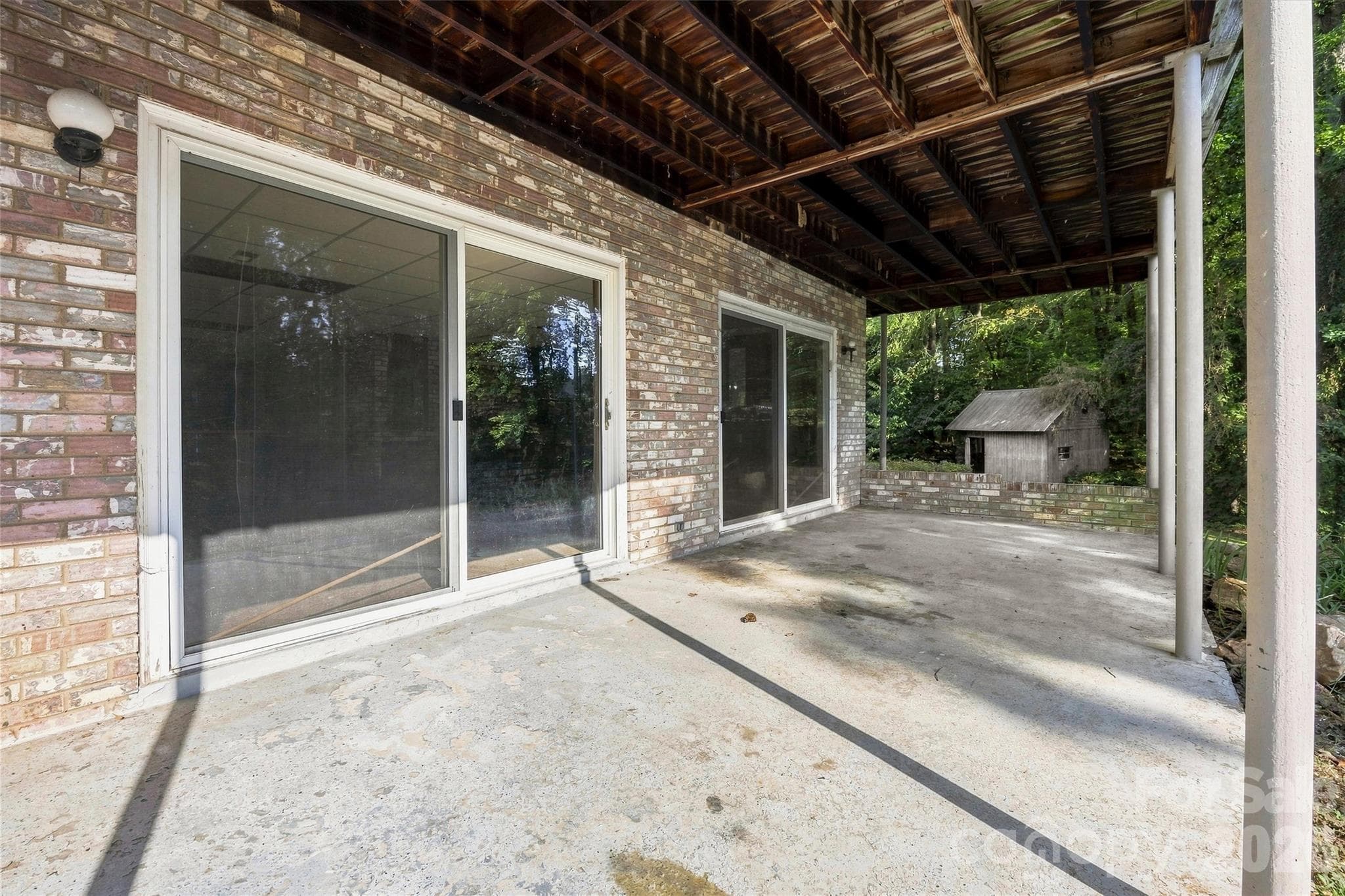 Lower level patio with walkout access to the lake - 131 Baywatch Drive, Mooresville