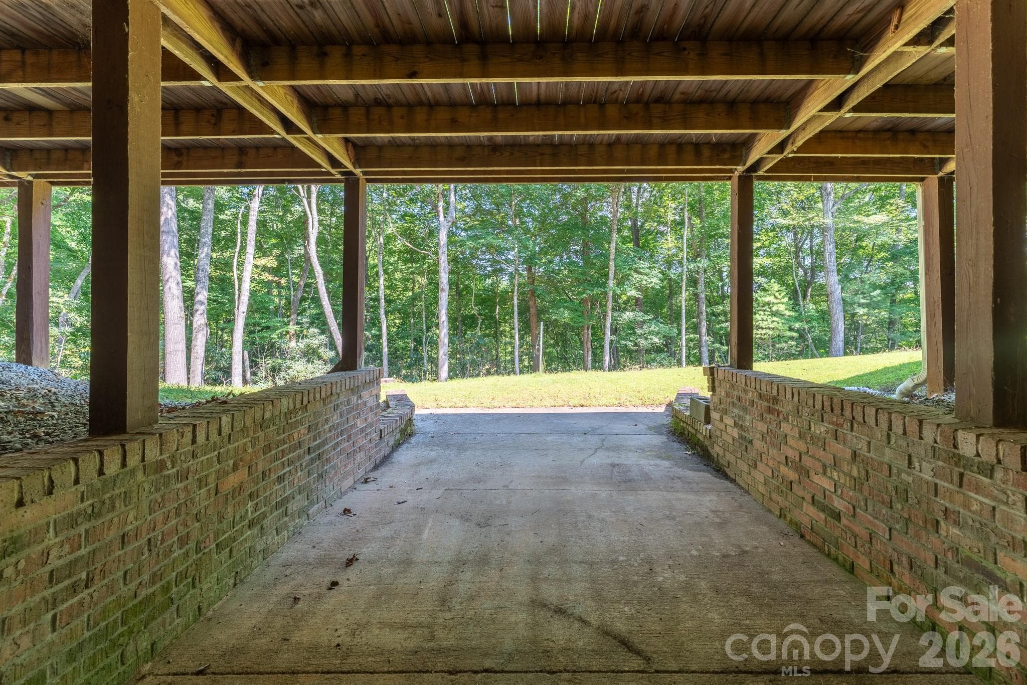 Walkout the sliding glass doors to the detached garage. - 1886 Tanasee Gap Road, Balsam Grove