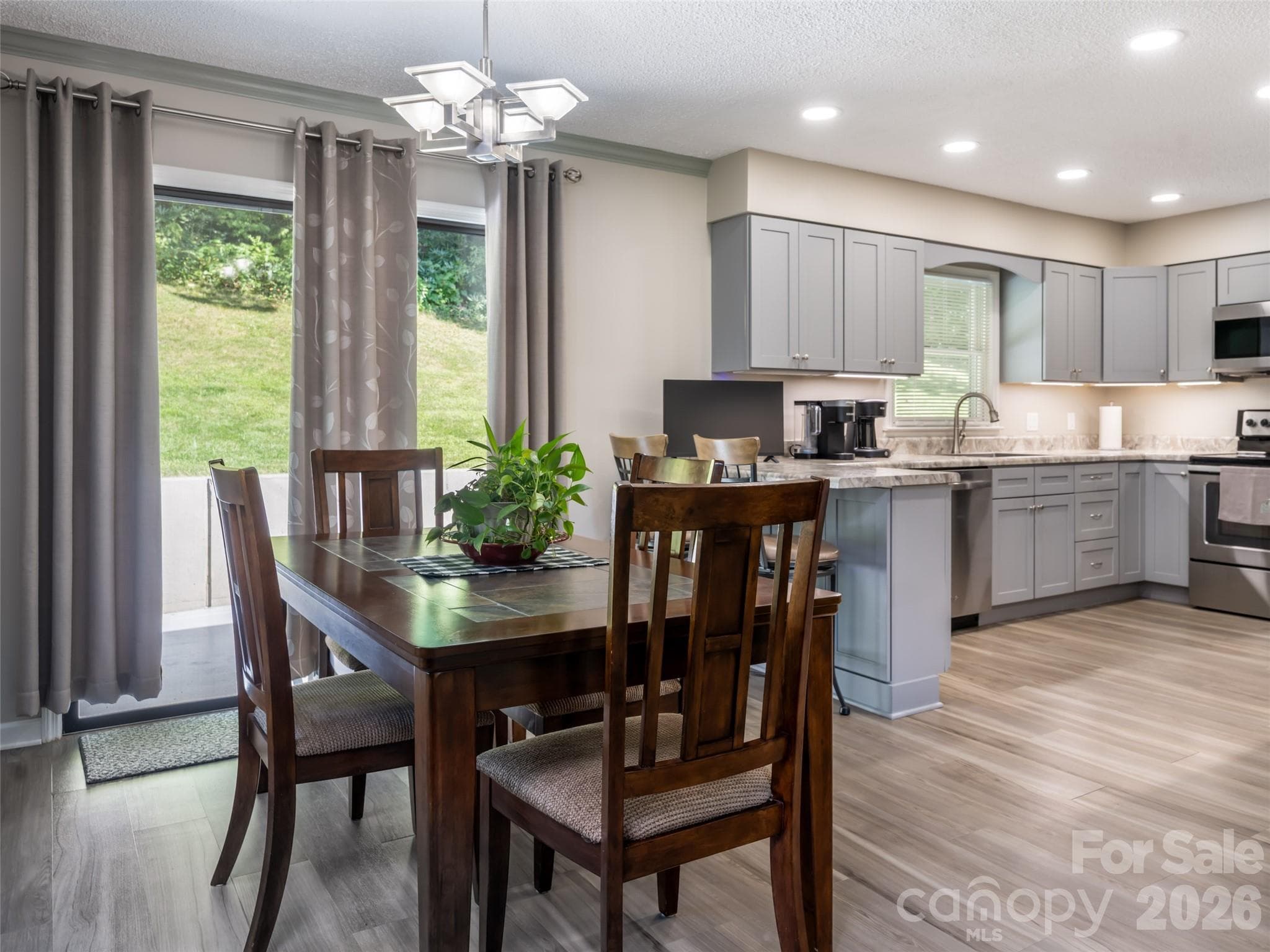 Seamless access to the private patio and backyard. - 1 Morris Drive, Weaverville