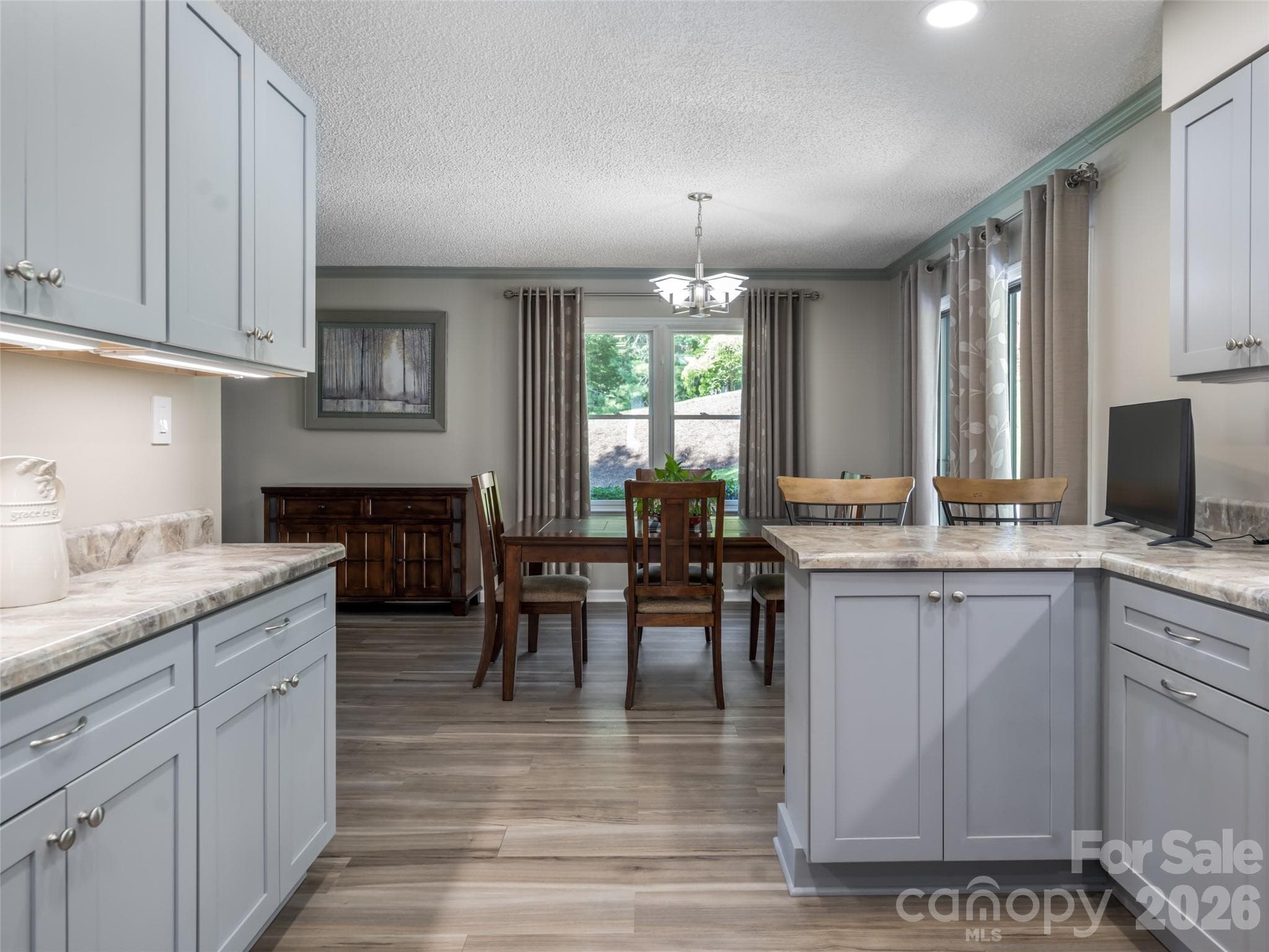 Large windows enhancing the natural lighting. - 1 Morris Drive, Weaverville