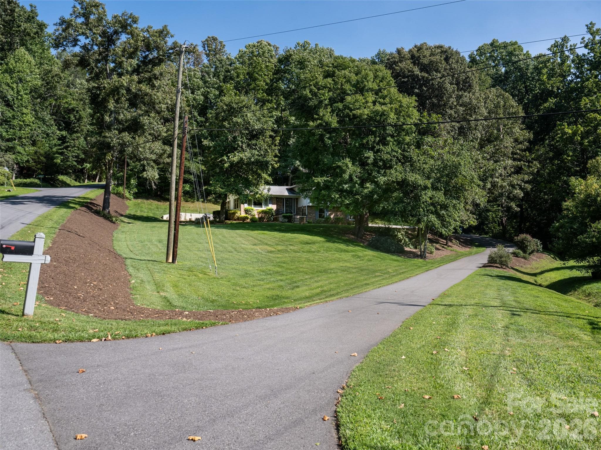 Your own private, recently-paved driveway, flowing alongside the pristine grounds. - 1 Morris Drive, Weaverville