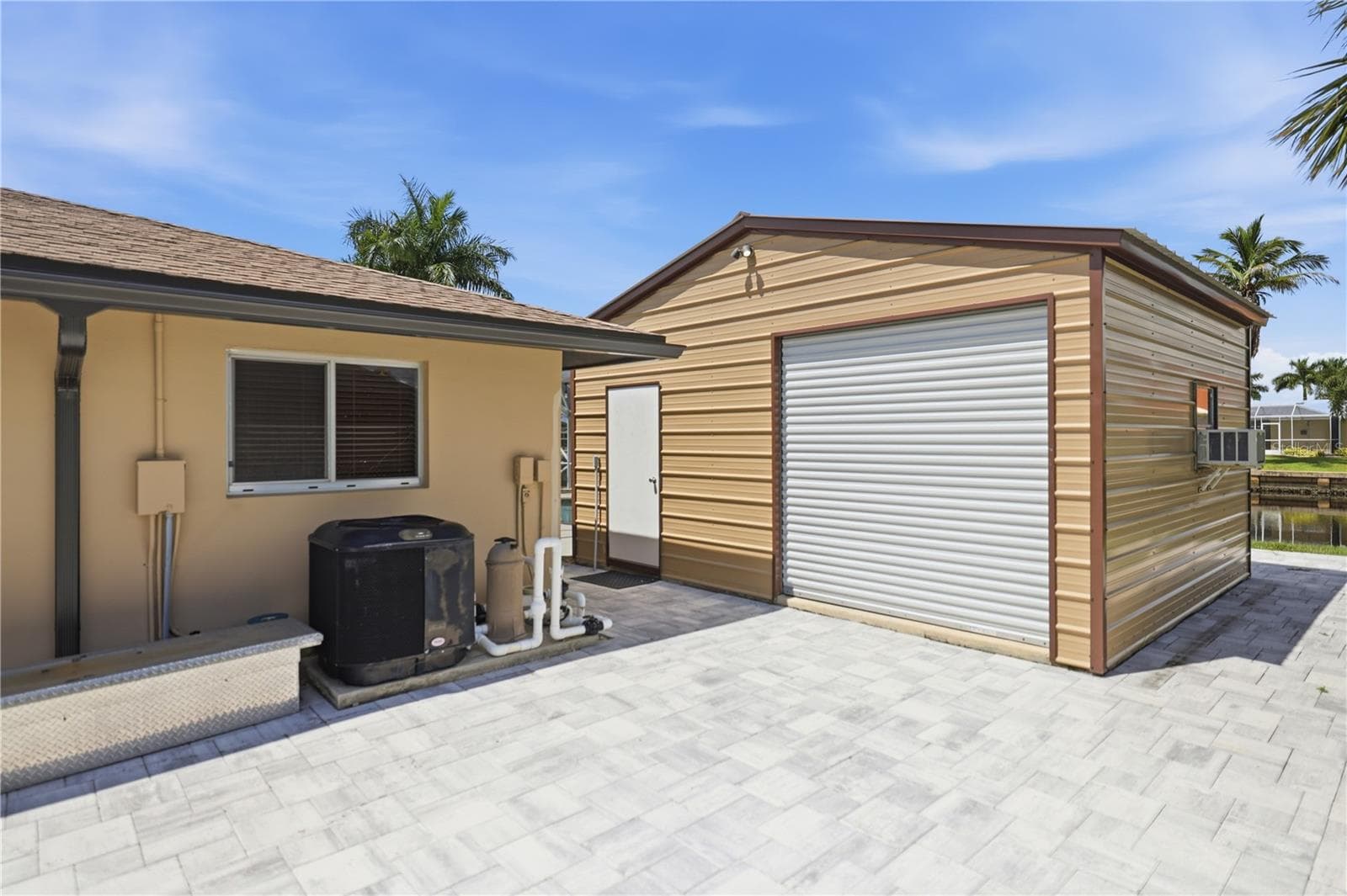 Extra pavers on right side of home, nice workshop with window a/c - 136 SINCLAIR ST SE, PORT CHARLOTTE