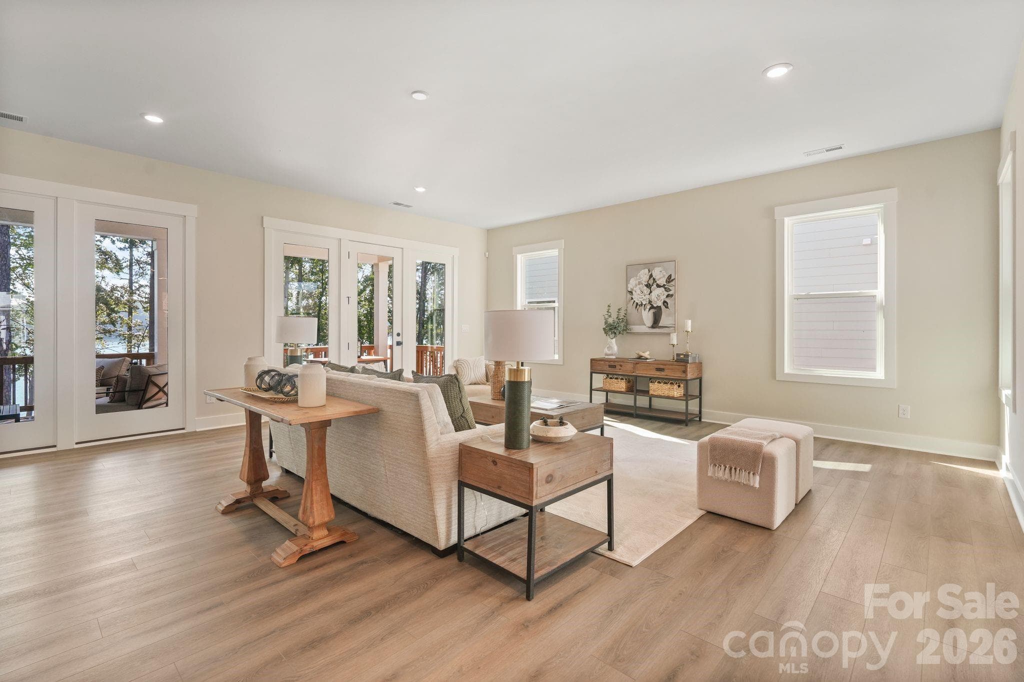 Spacious family room pre-wired for surround sound and includes glass doors to covered deck - 4531 Splash Trail, Sherrills Ford