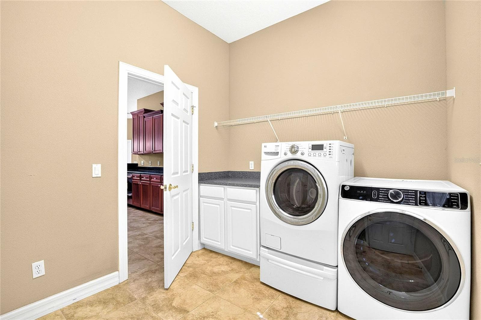 LAUNDRY, SHELVING AND FOLDING AREA - 13975 MCINTOSH RD, THONOTOSASSA