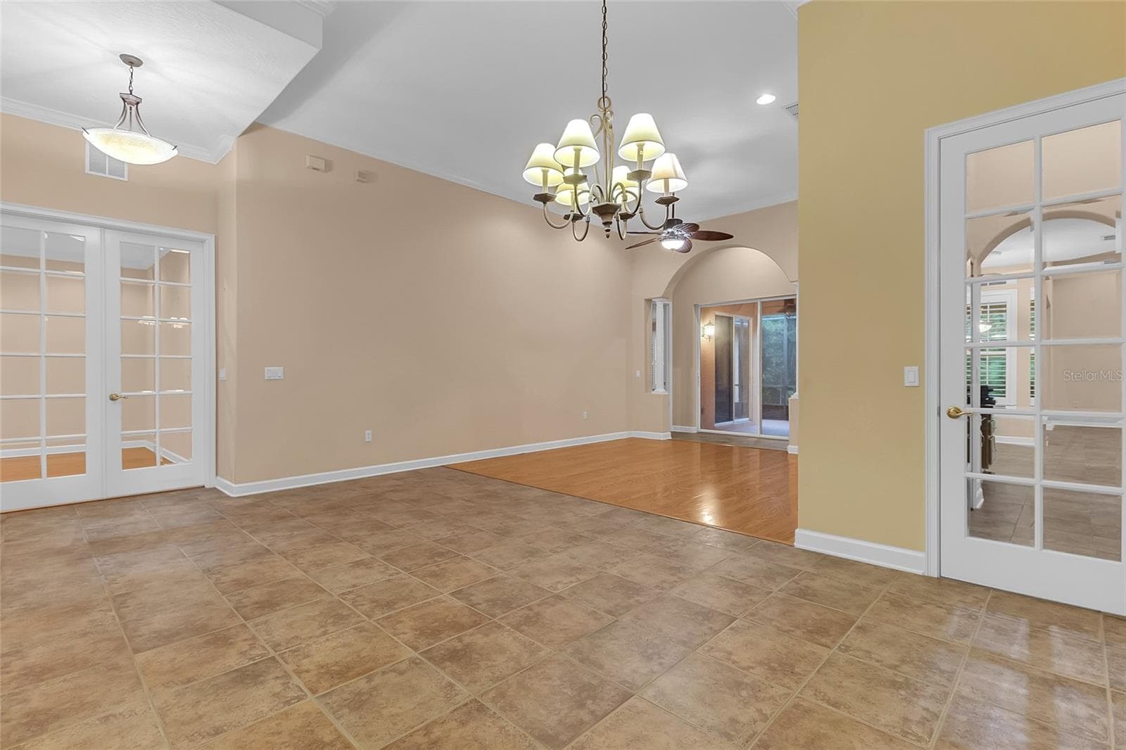 Dining Room/Formal Living Room. The 8' French Doors lead to the Office while the 8' Single Door lead to the Kitchen/Laundry Room. - 2672 ALOMA OAKS DR, OVIEDO