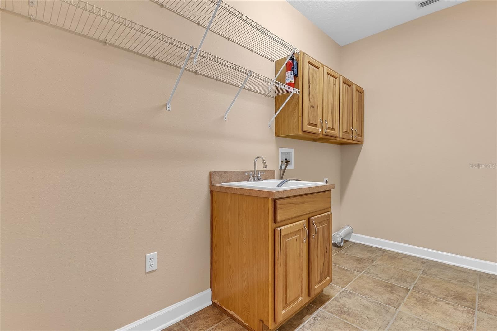 Large Laundry Room that leads to the 3 Car Garage - 2672 ALOMA OAKS DR, OVIEDO
