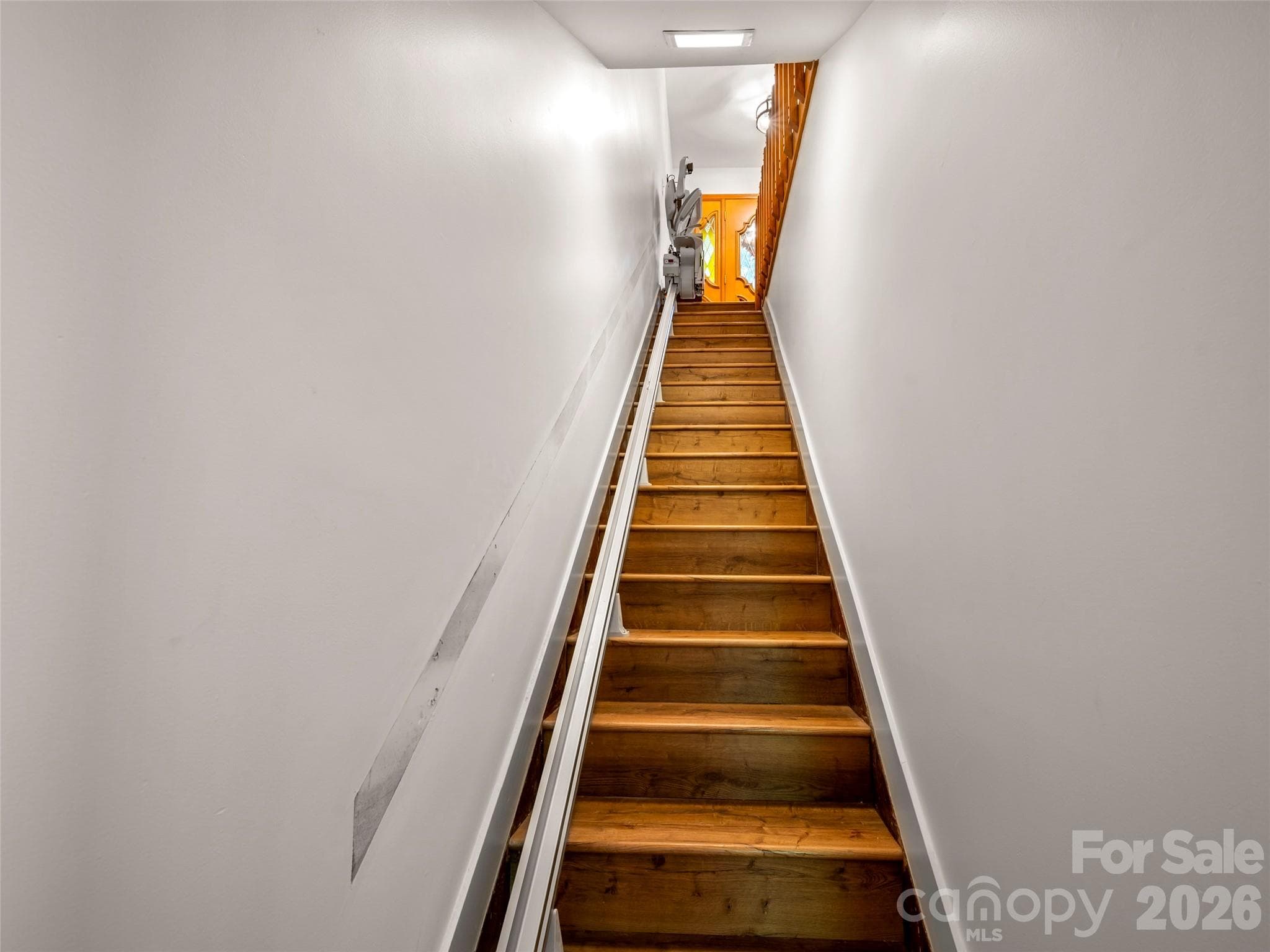 Stairs to get down to the other 2 bedrooms in the Basement has stairlift, but can easily be taken off. - 58 Timbertop Lane, Etowah