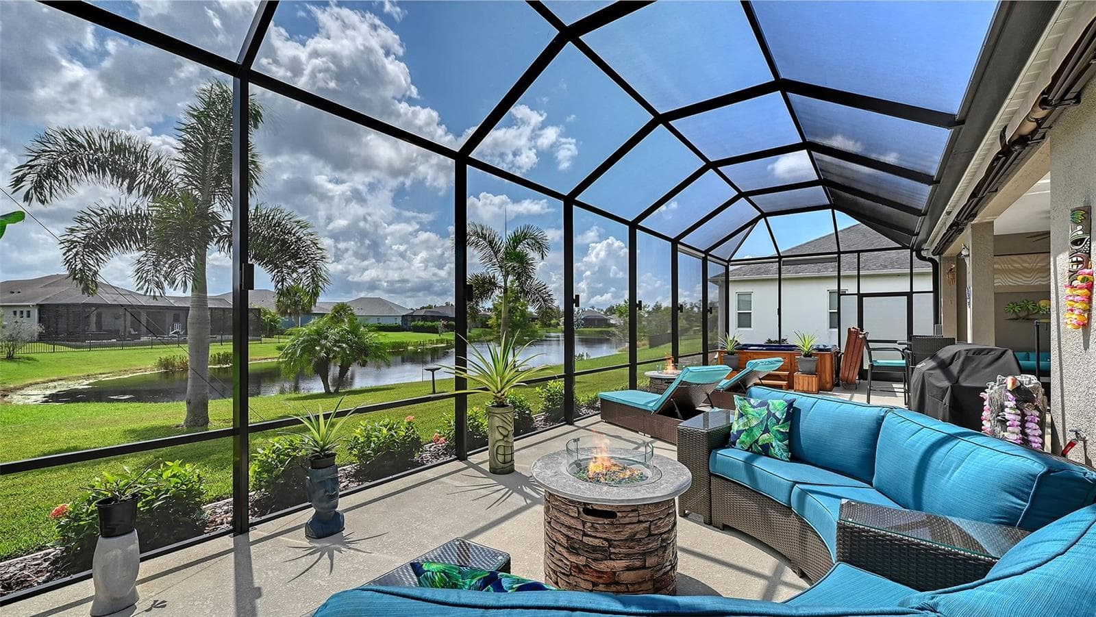 Outdoor entertaining area with pond views - 13667 OLD CREEK CT, PARRISH