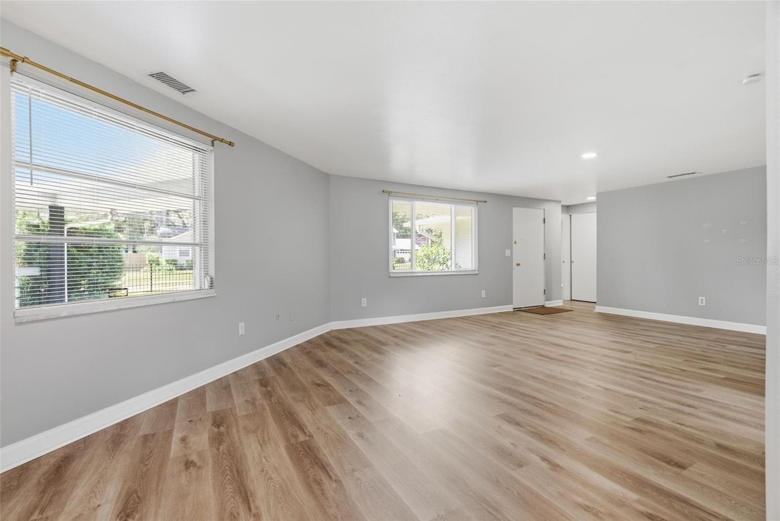 Open floor plan with Luxury Vinyl Plank flooring - 6701 13TH ST N, TAMPA