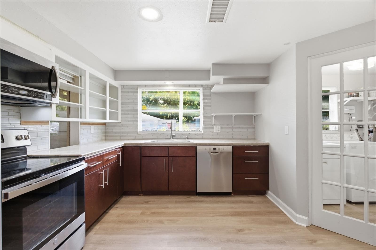 Laundry is adjacent to Kitchen - 6701 13TH ST N, TAMPA