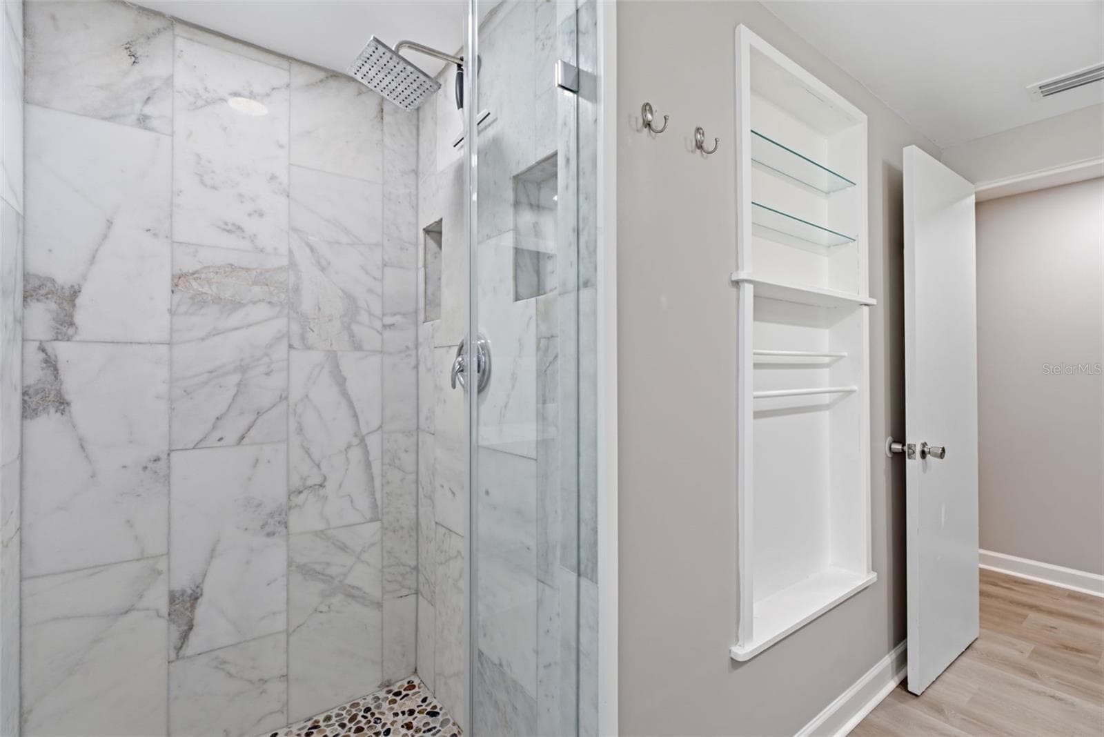 Primary Shower, open shelving with towel bars - 6701 13TH ST N, TAMPA