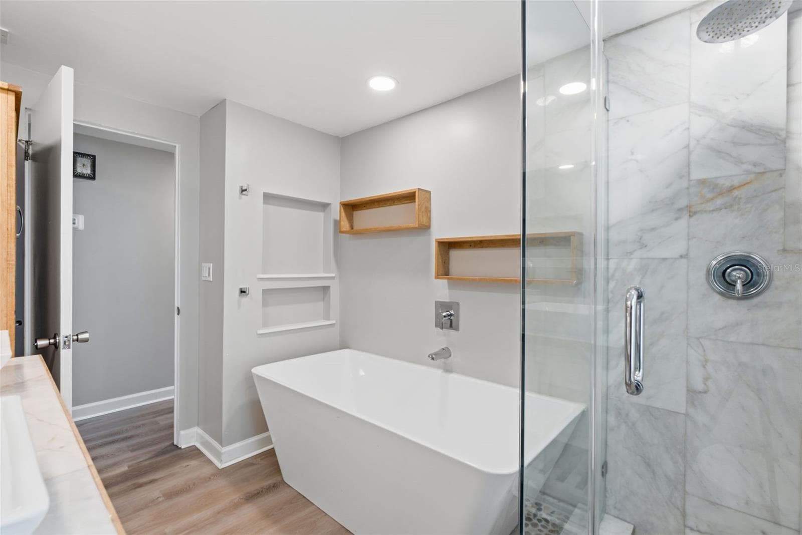 Bathroom 2 with freestanding tub & shower - 6701 13TH ST N, TAMPA