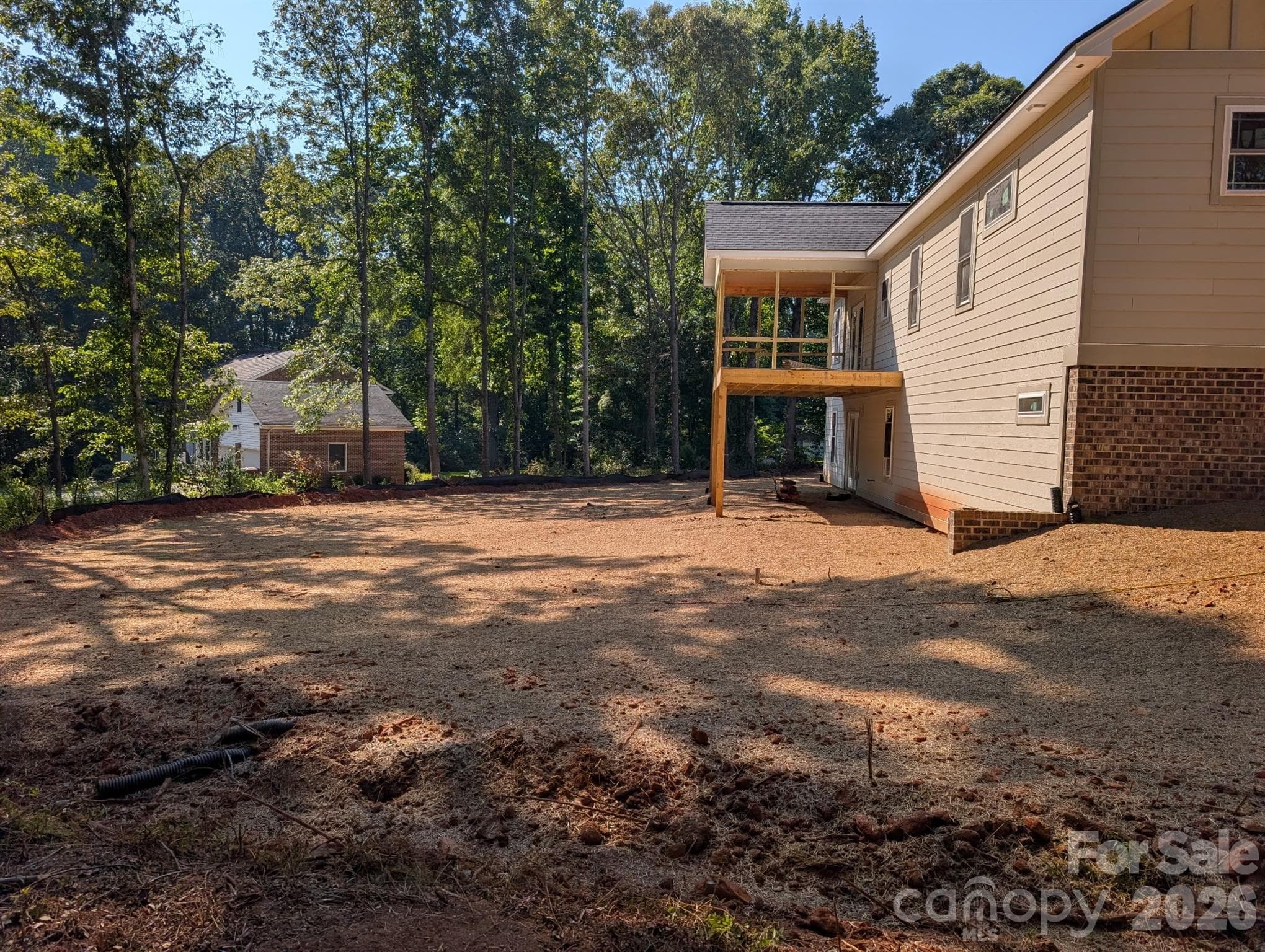 View of the rear covered screened in deck - 1895 Knolls Drive, Newton