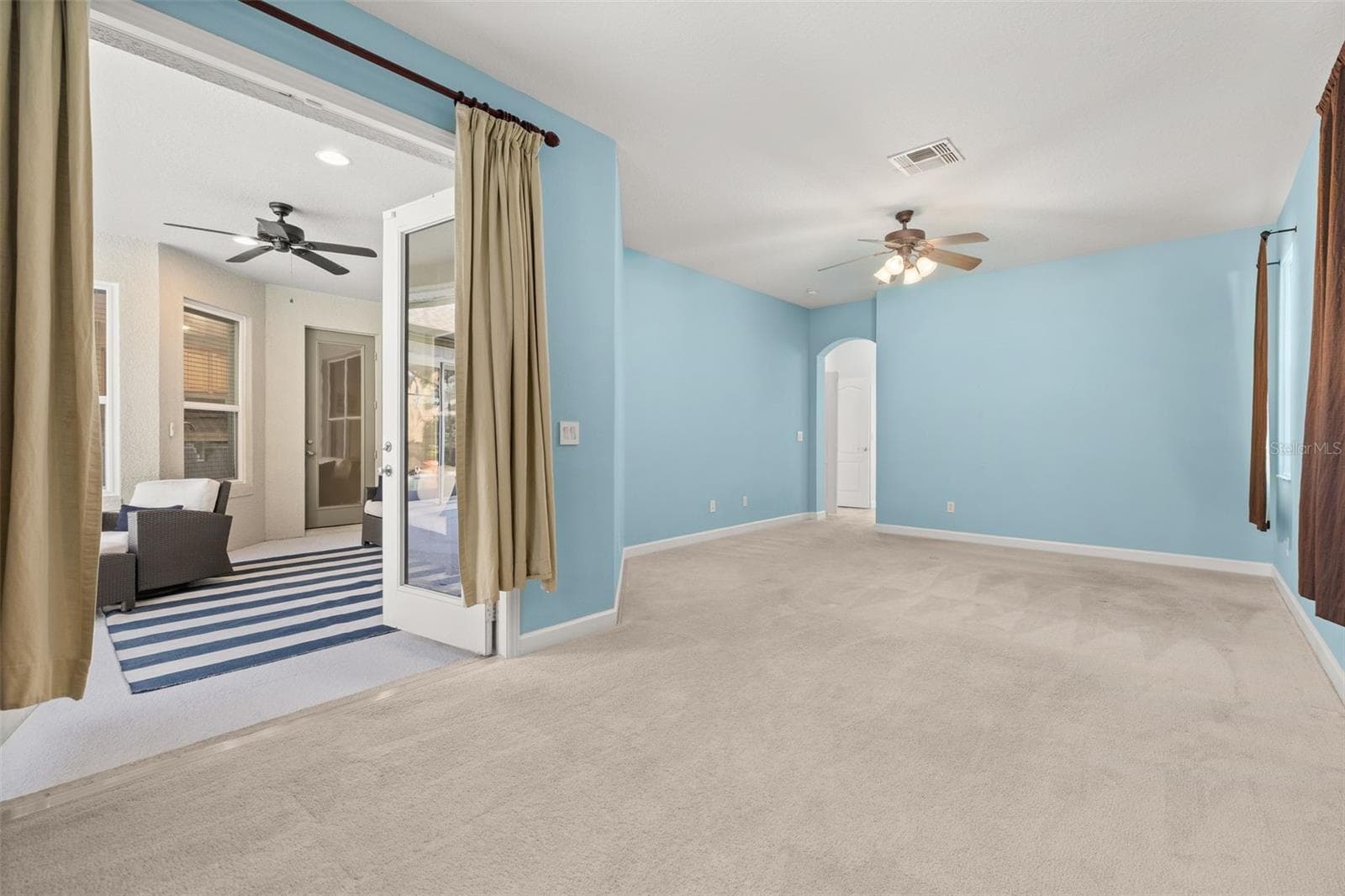 Primary suite with private French doors entrance to the back patio - 2039 HARBOR COVE WAY, WINTER GARDEN
