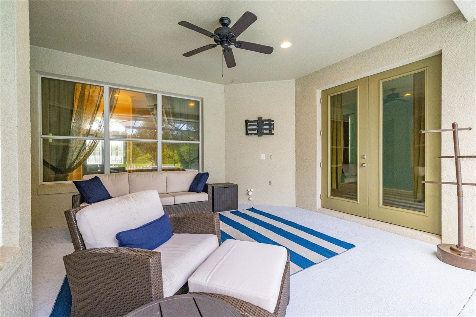 Covered patio with access from the primary suite - 2039 HARBOR COVE WAY, WINTER GARDEN