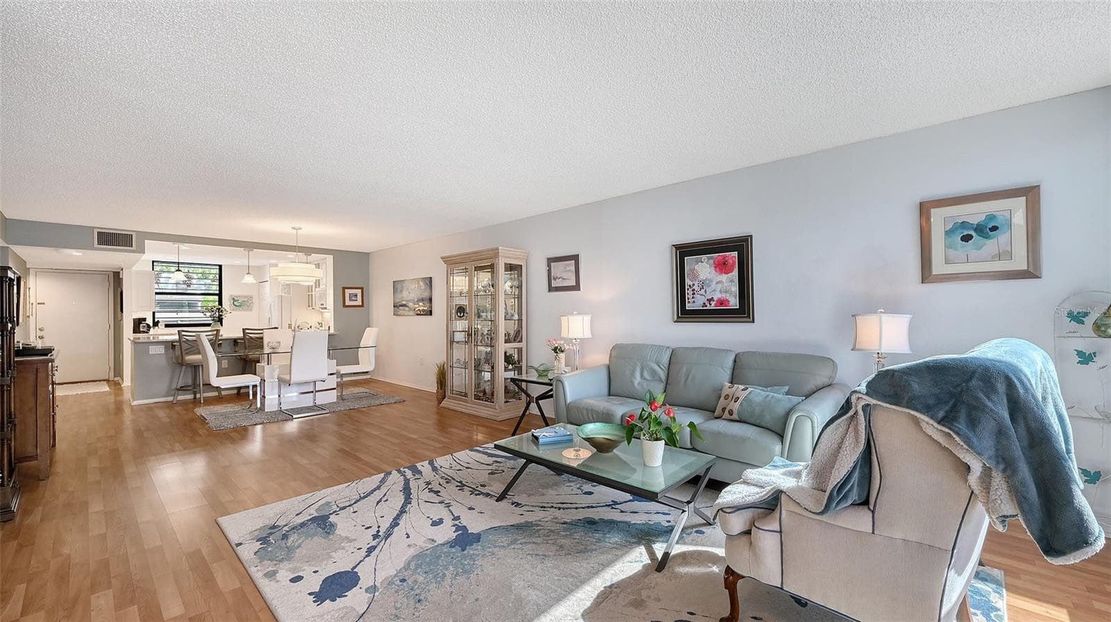Another view of living room and dining room. most furnishings are available for purchase outside of closing. - 666 WOODLAWN DR #666, BRADENTON