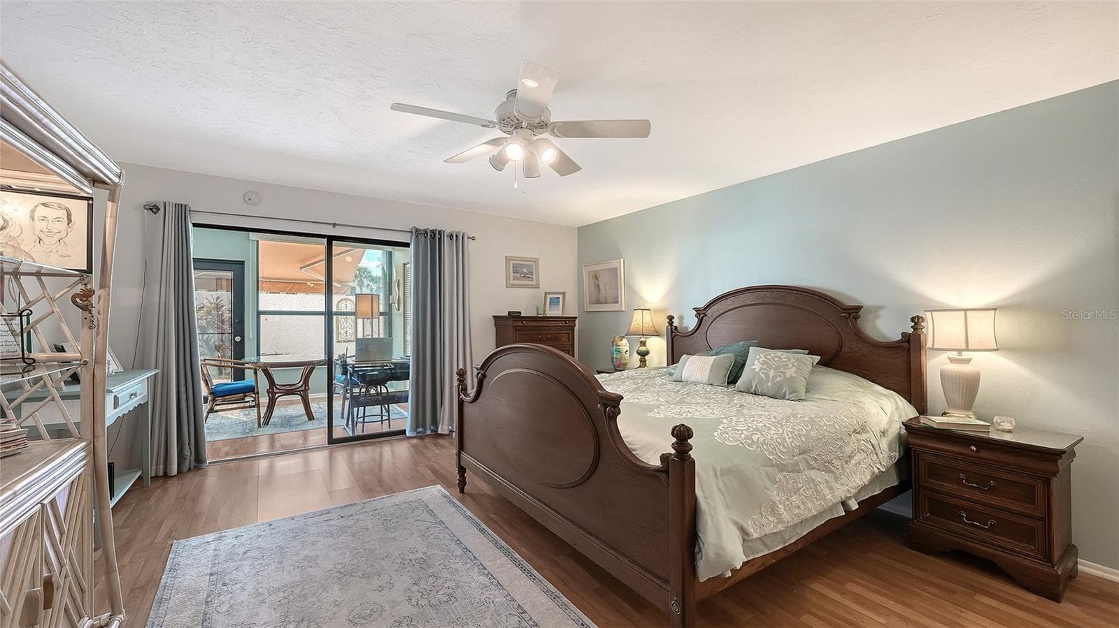 The view is into the former lanai area that is furnished with a breakfast table and a small desk. - 666 WOODLAWN DR #666, BRADENTON