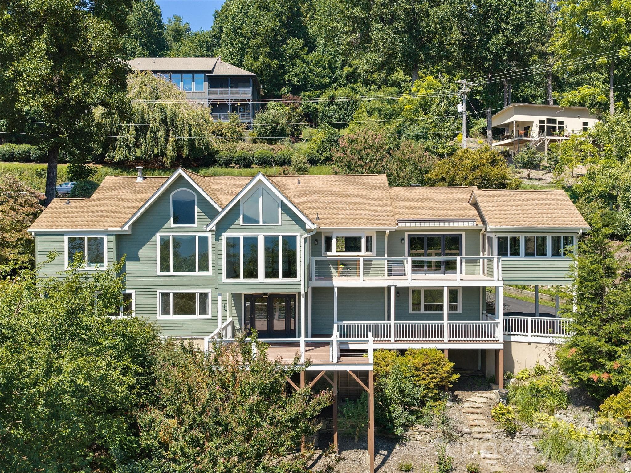 View-Side Showcasing Expansive windows and multiple outdoor living areas - 288 Roberts Drive, Laurel Park