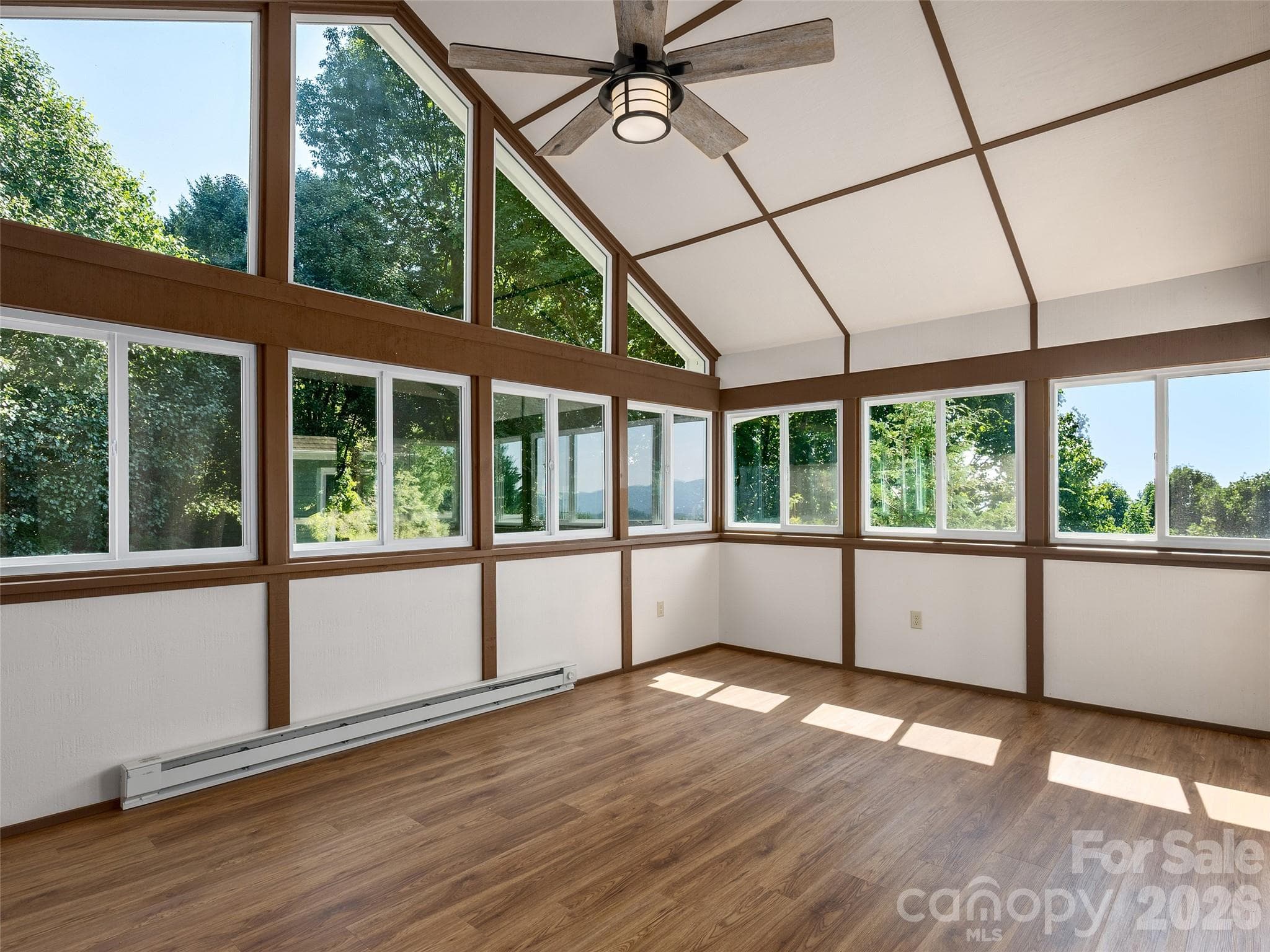 Sunroom with mountain views and access to large deck - 288 Roberts Drive, Laurel Park