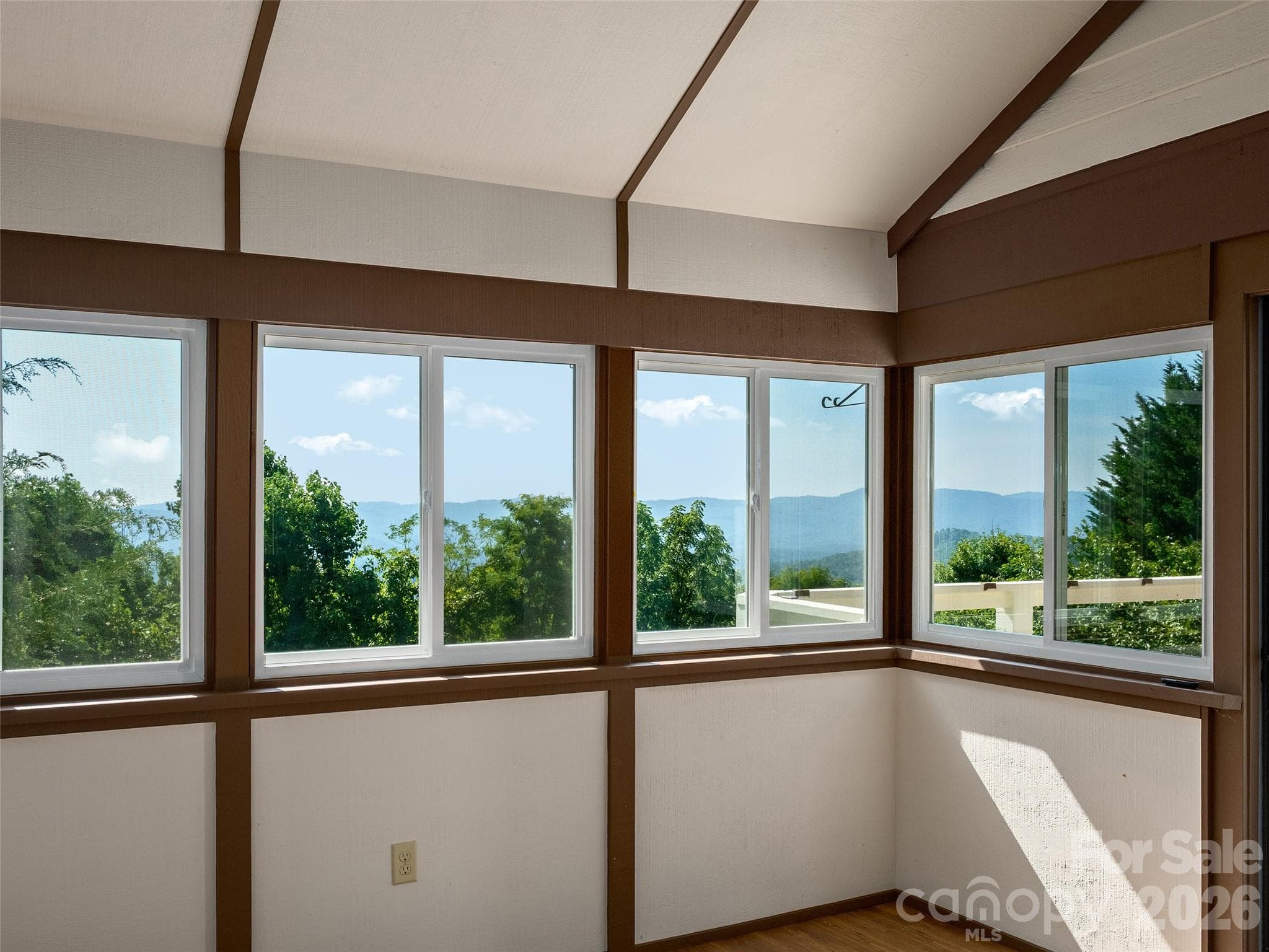 Walls of windows capture beautiful mountain views - 288 Roberts Drive, Laurel Park