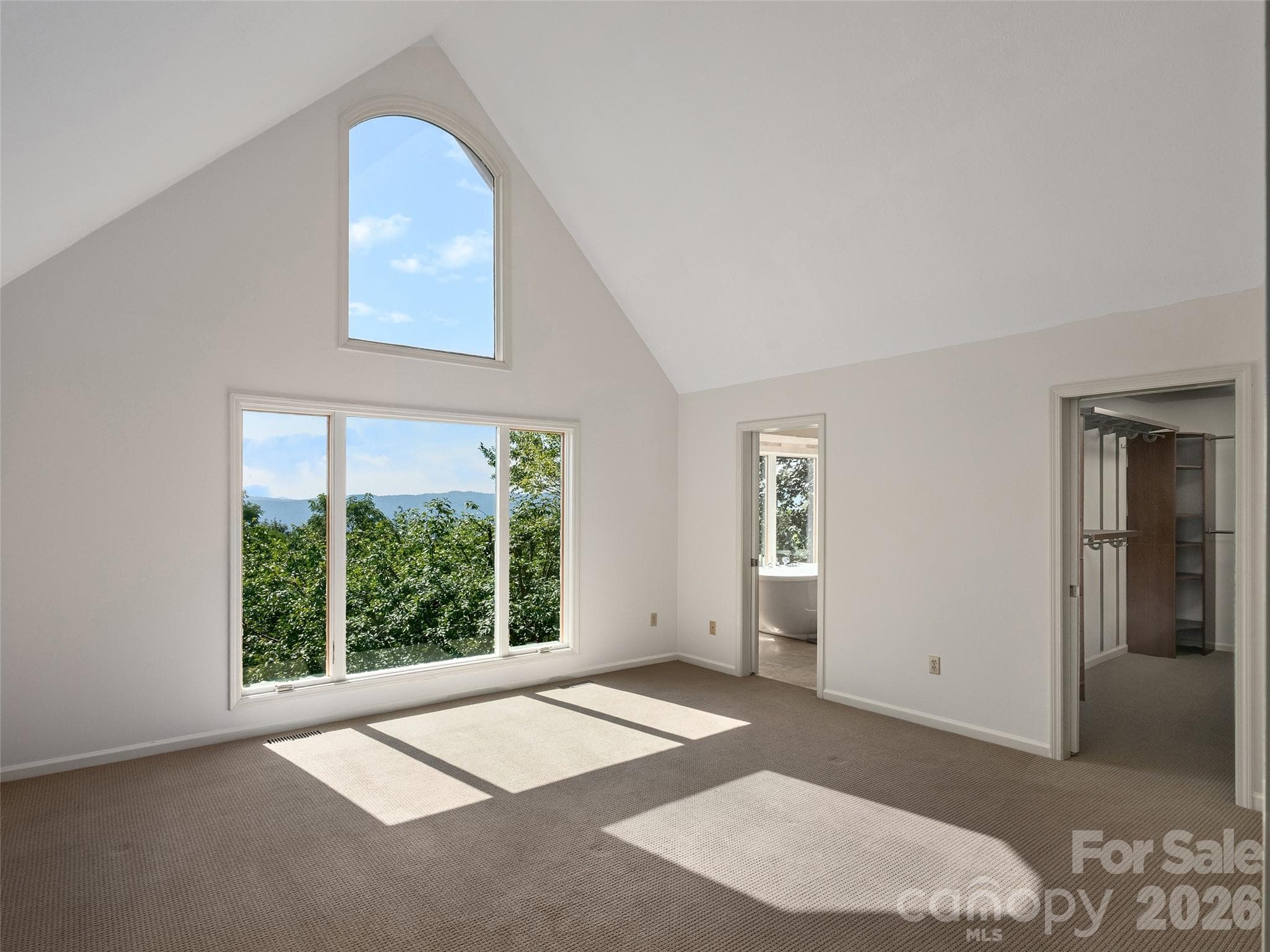 Vaulted Primary Bedroom filled with natural light and mountain views - 288 Roberts Drive, Laurel Park