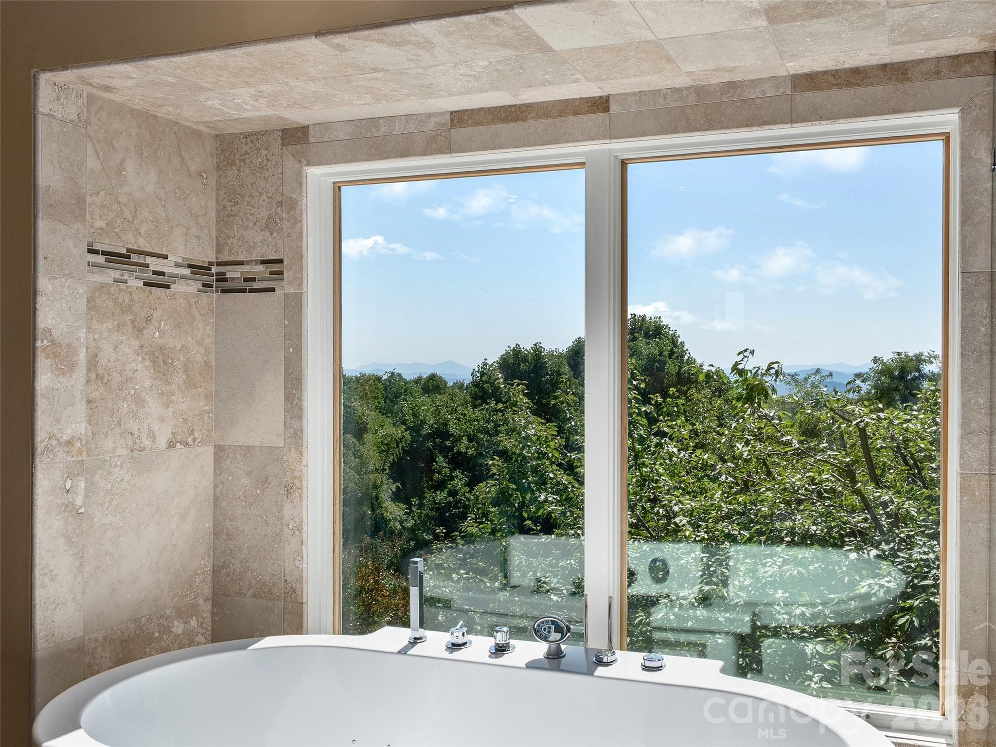 Relaxing soaking tub with lots of natural light and incredible views - 288 Roberts Drive, Laurel Park