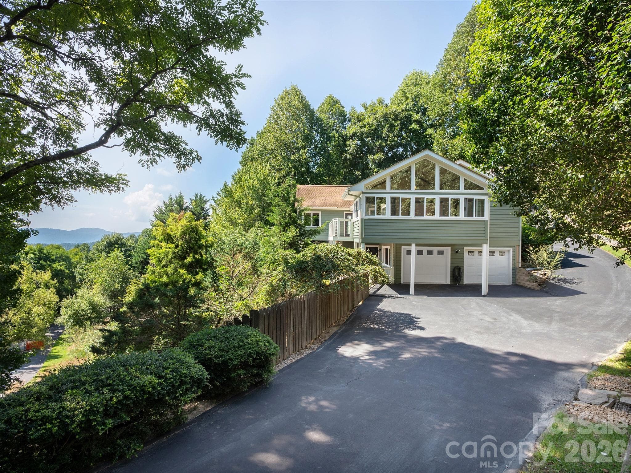 Driveway entry to two car garage circling to main level entrance - 288 Roberts Drive, Laurel Park