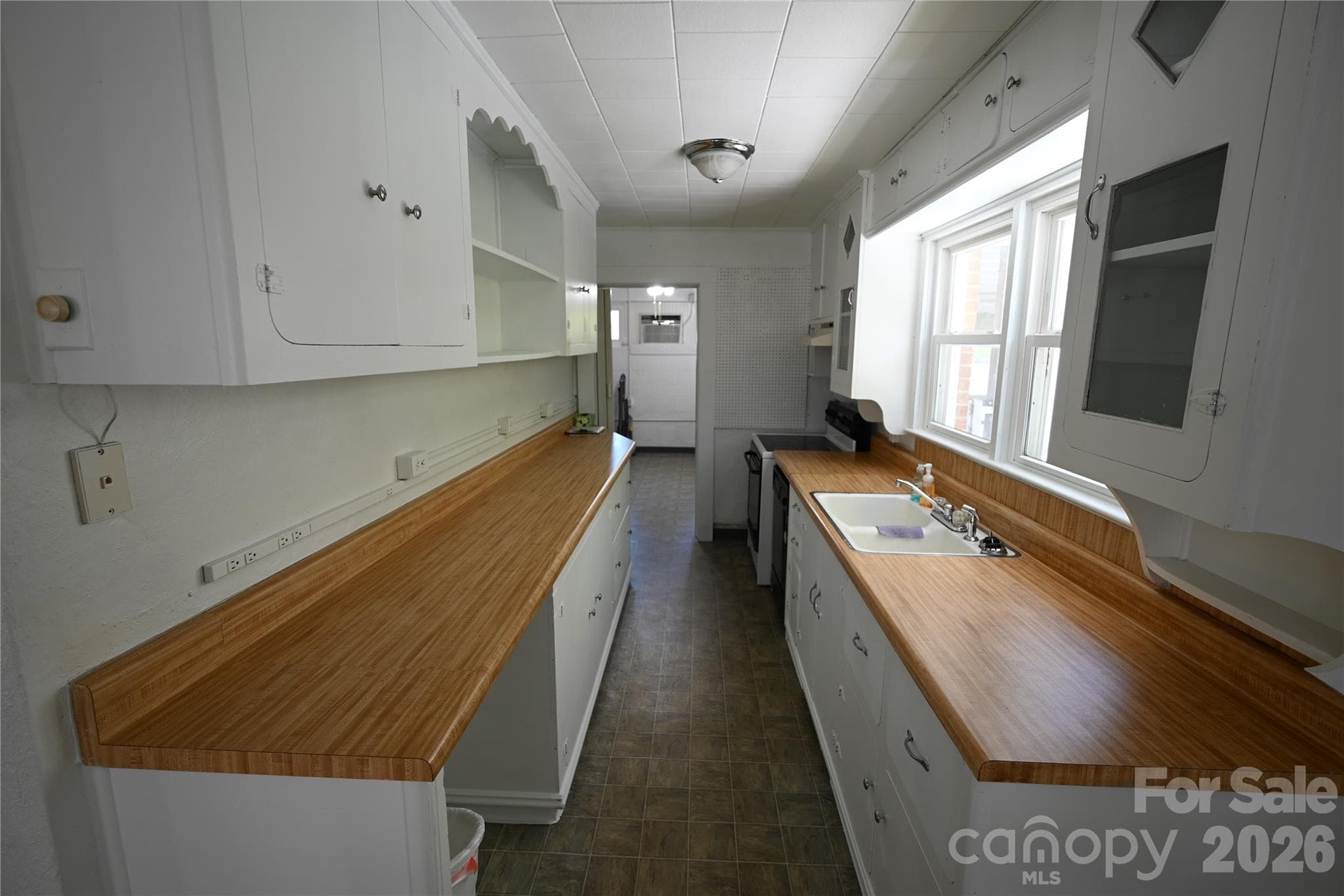 Single Family Residence at 105 Owens Avenue NE, Drexel, photo 12 of 38