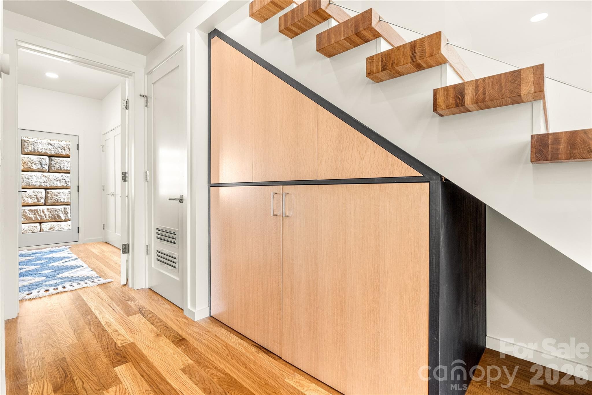 Built ins and laundry under the stairs. - 4 Roberts Street, Asheville