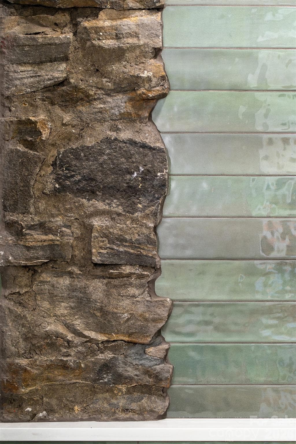 Original fieldstone pillars incorporated into the modern design. - 4 Roberts Street, Asheville