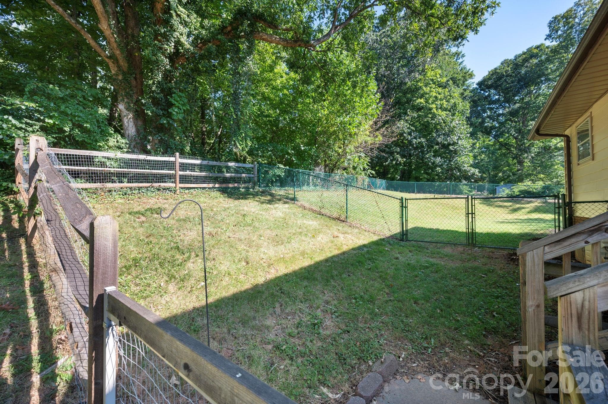 Fully fenced front yard with separate fenced yard dedicated to the apartment - 2 Independence Boulevard, Asheville