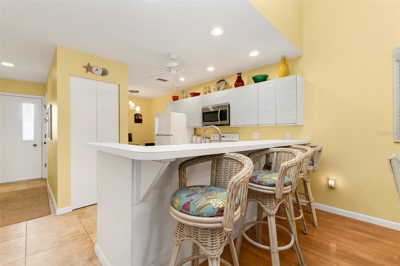 Pull up a stool and relax at the kitchen bar. - 6800 PLACIDA RD #235, ENGLEWOOD