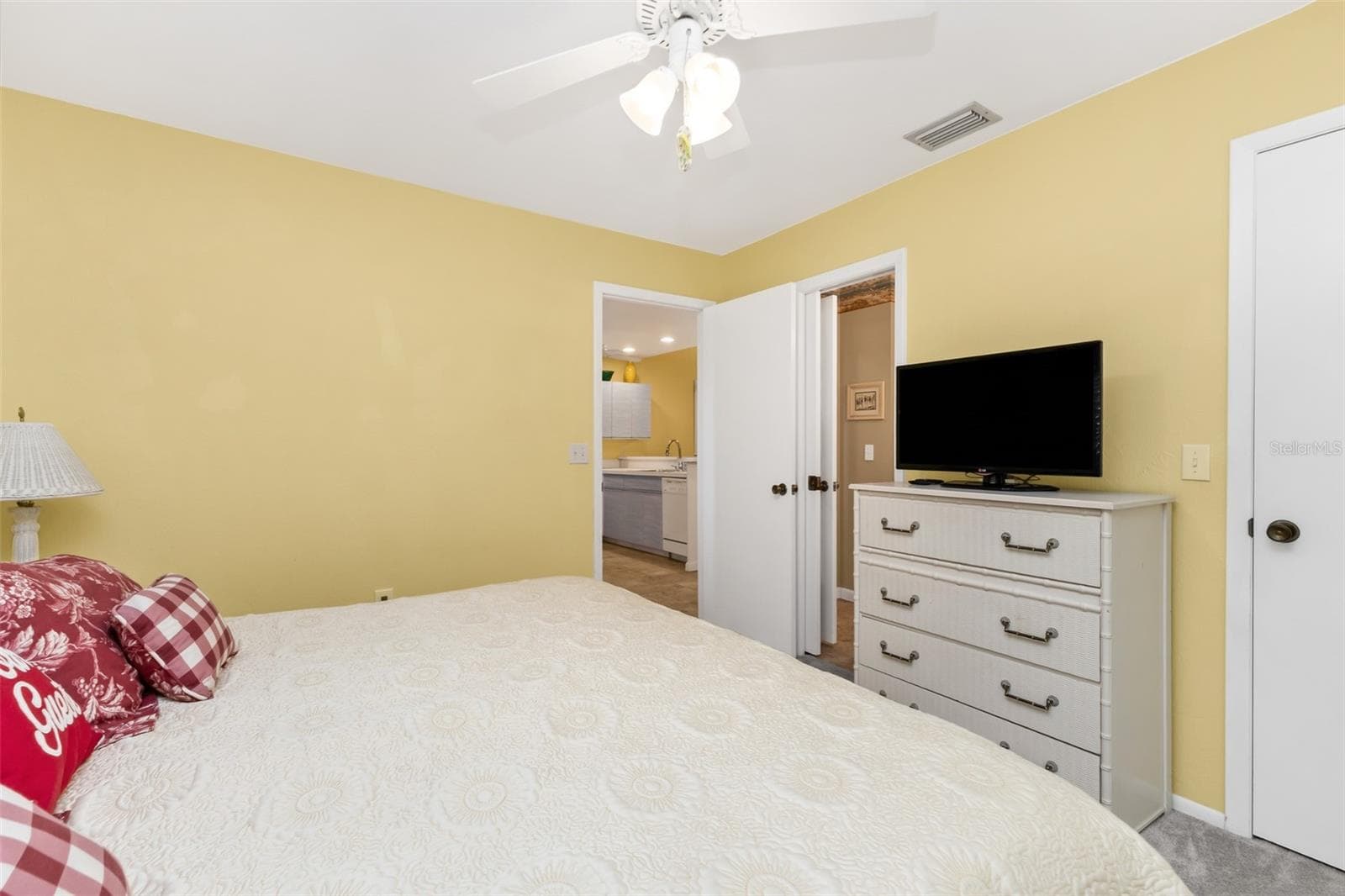 Guest bedroom with dresser, comfortable bedding, walk in closet. - 6800 PLACIDA RD #235, ENGLEWOOD
