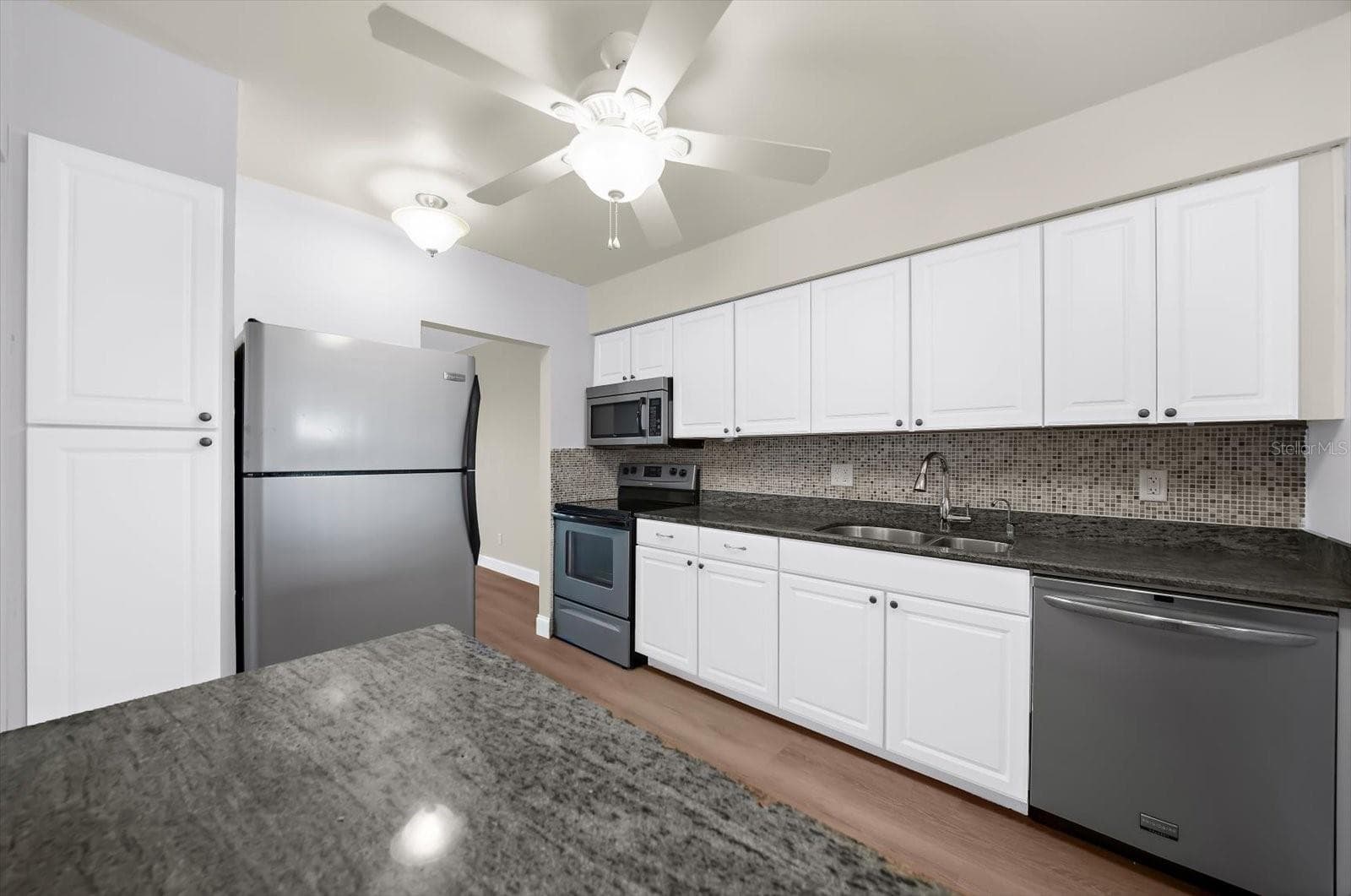 Another view of the kitchen showing the large pantry - 868 BAYWAY BLVD #307, CLEARWATER BEACH
